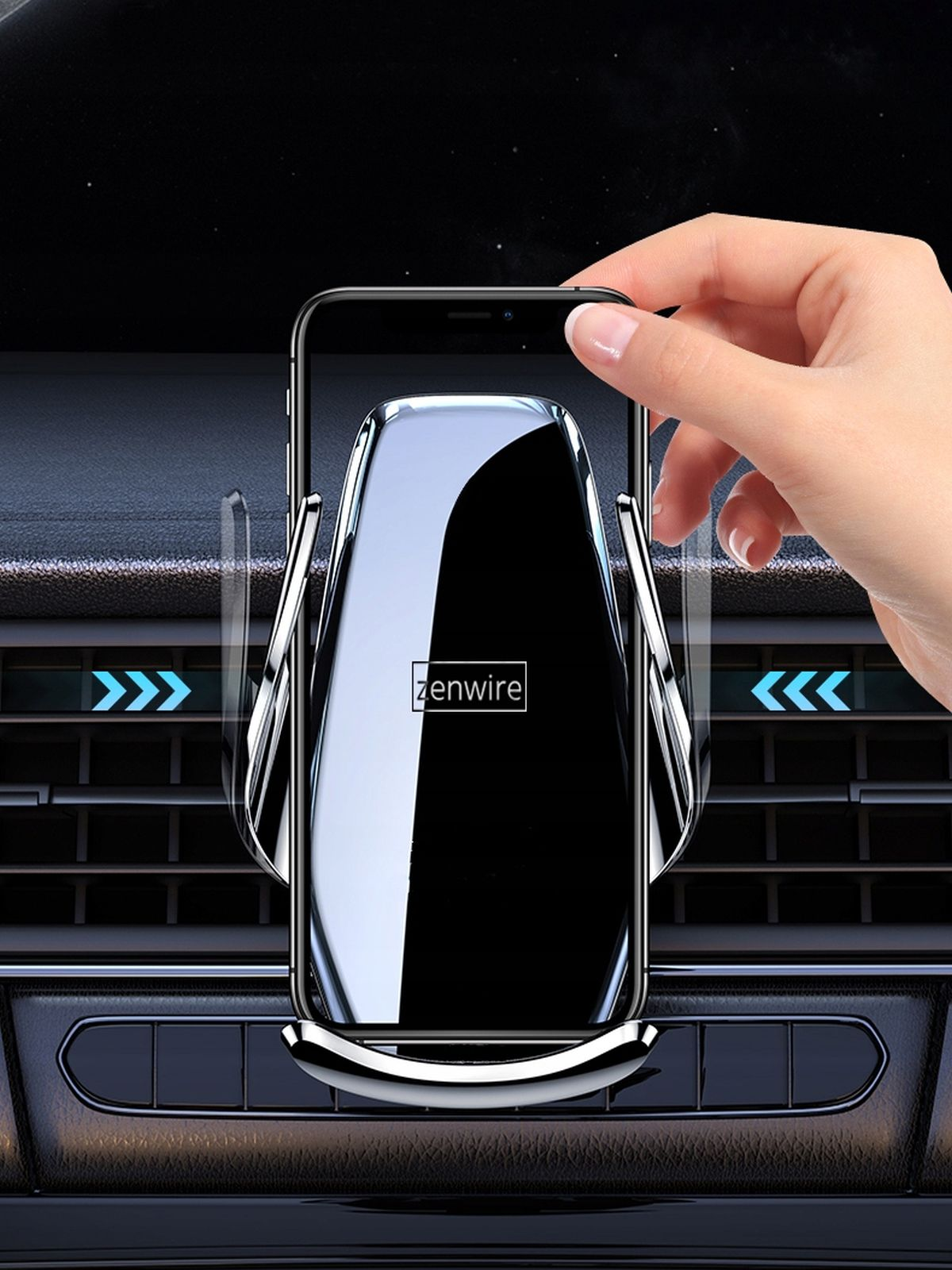 Ręka umieszczająca telefon w uchwycie samochodowym zamontowanym na kratce wentylacyjnej samochodu. Strzałki wskazują akcję.