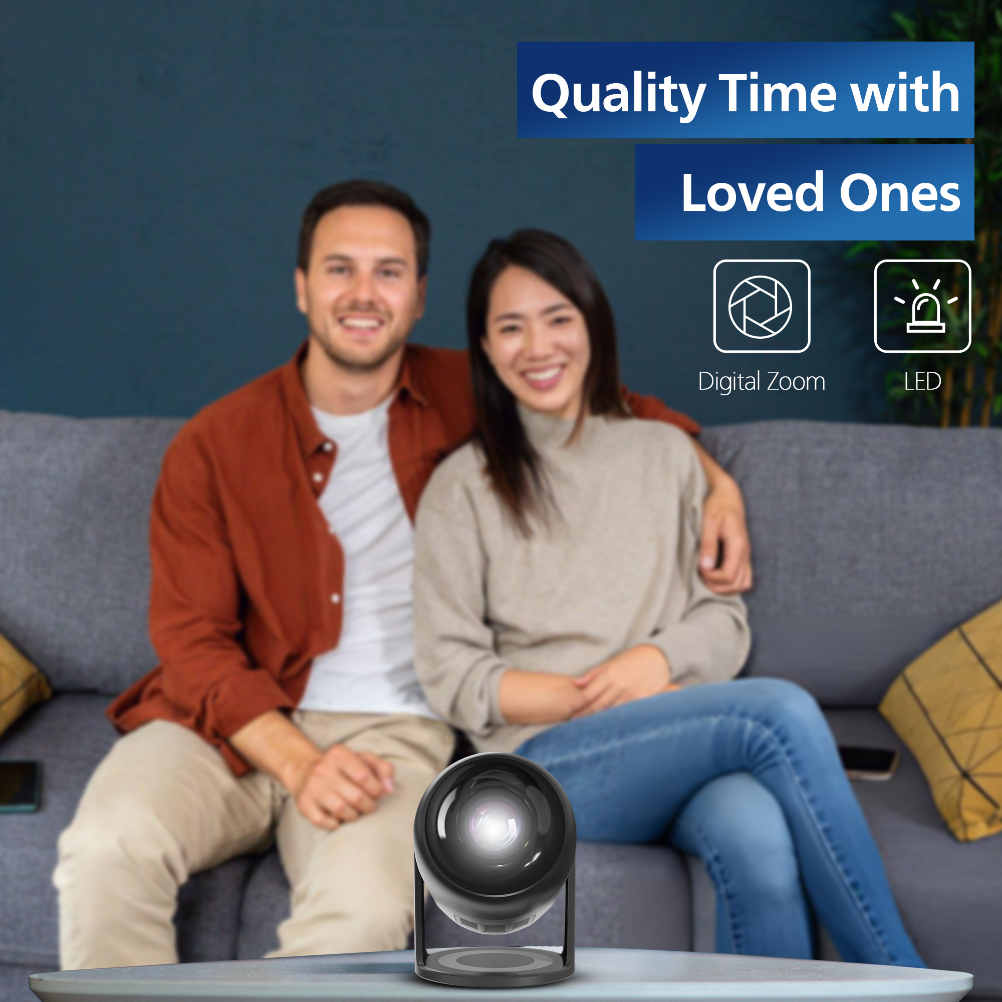 A couple on a sofa with a projector on a table. Icons for zoom and LED are shown.