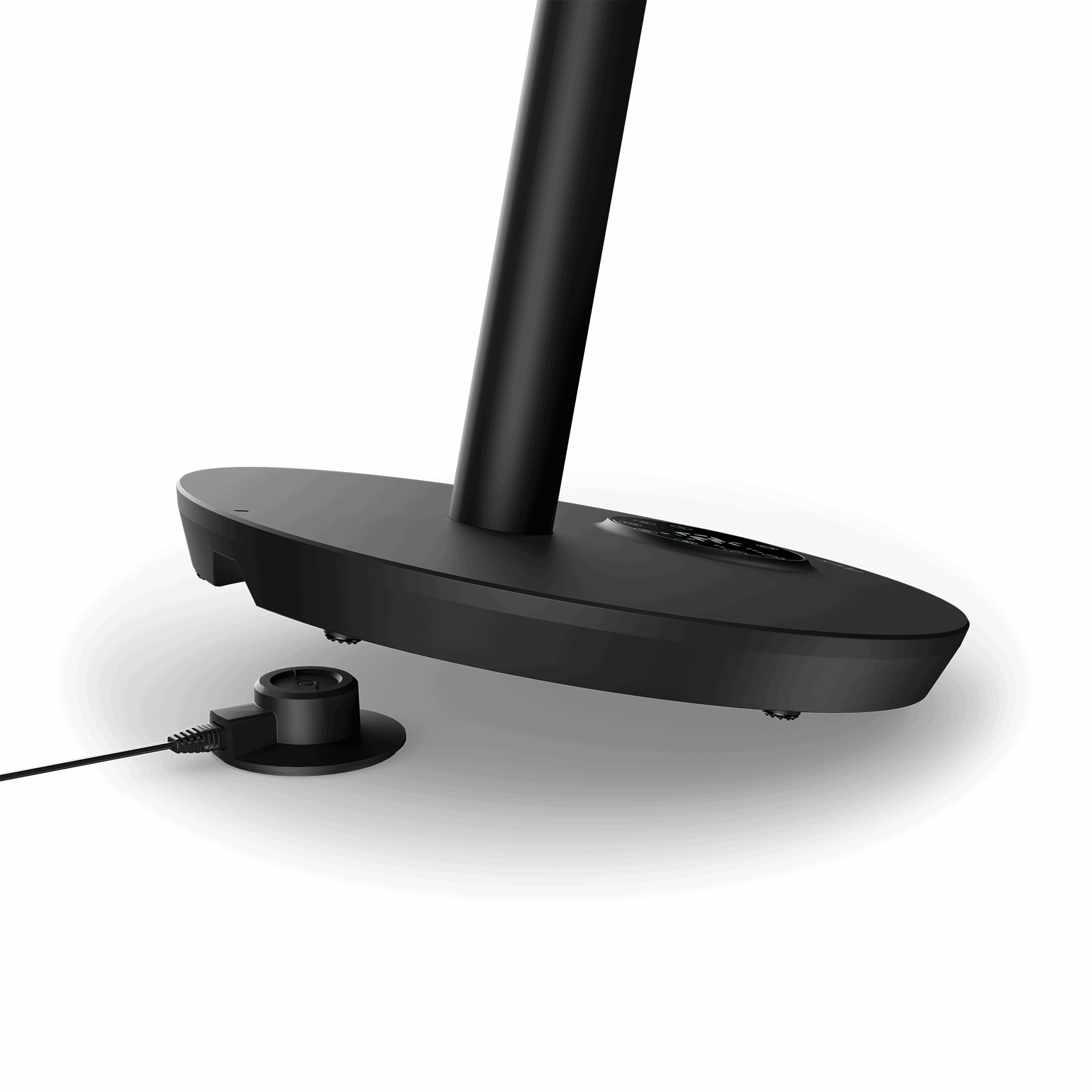 A black desk lamp base with a charging port, isolated on a black background.