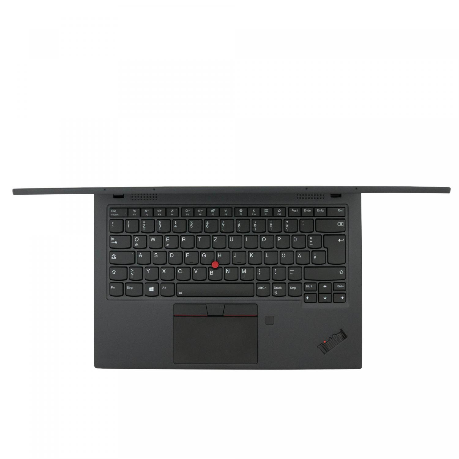 Eine Draufsicht auf eine schwarze Laptop-Tastatur mit einem roten Trackpoint in der Mitte.