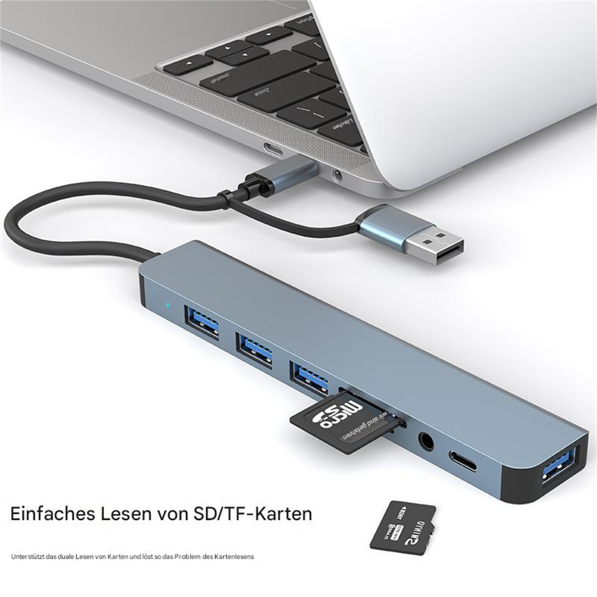 USB-Hub mit SD/TF-Kartensteckplätzen, an Laptop angeschlossen, mit Karten.
