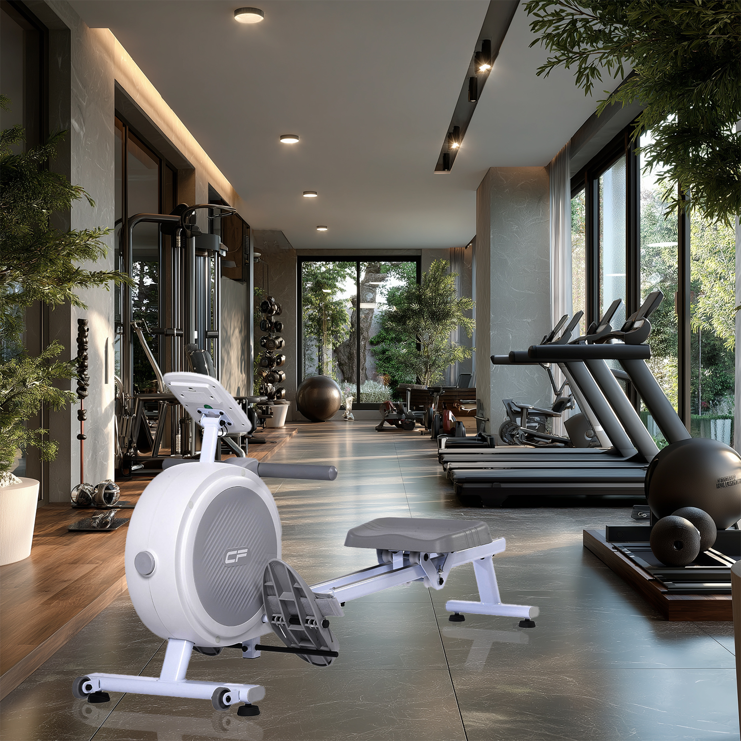 Gimnasio con cintas de correr, una máquina de remo y máquinas de pesas.