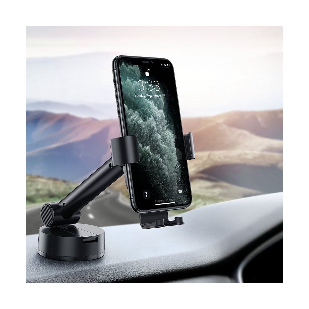 Telefon w uchwycie samochodowym na desce rozdzielczej. Telefon wyświetla godzinę.