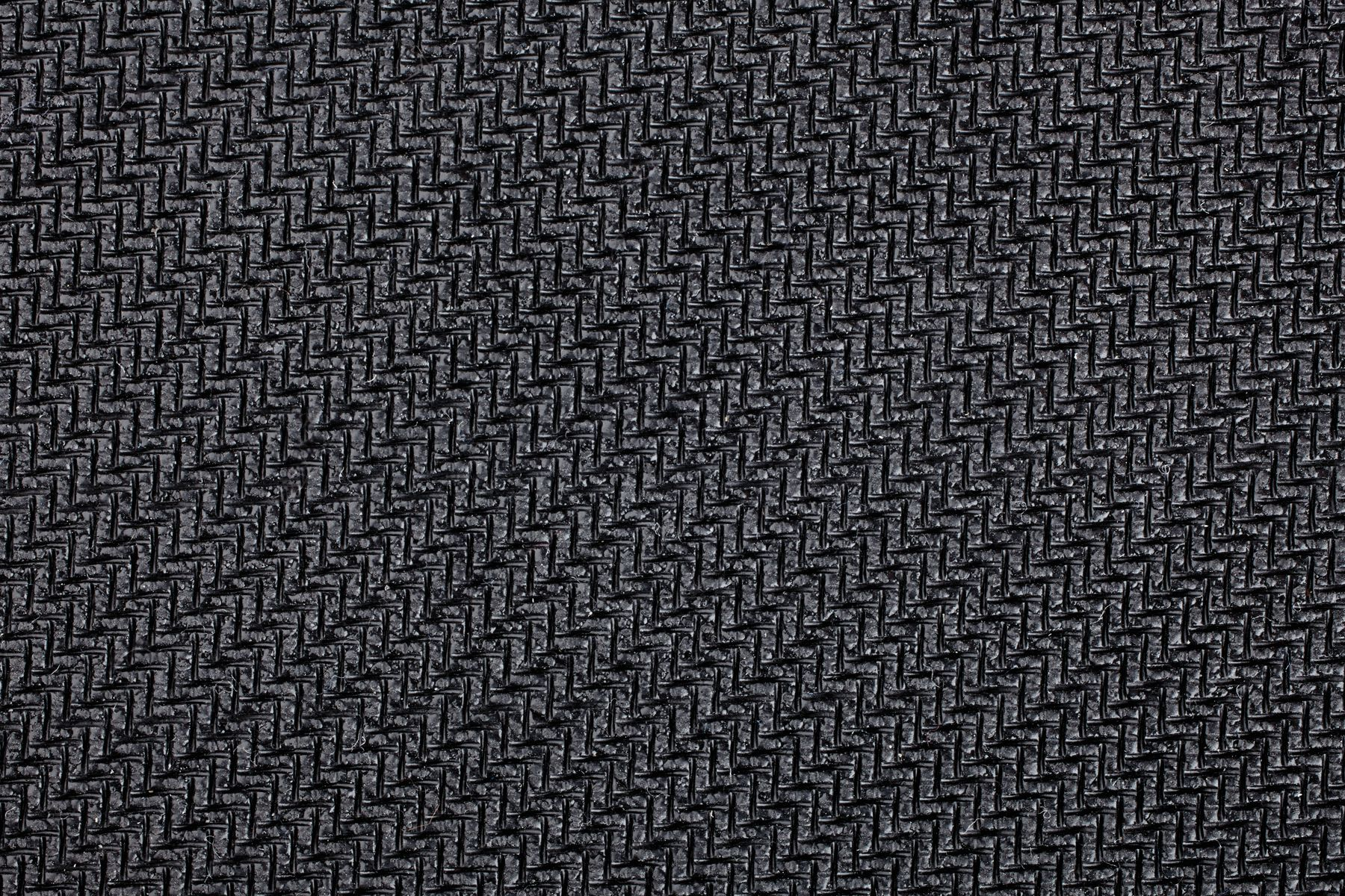 Close-up van een zwart, getextureerd oppervlak met een herhalend patroon.