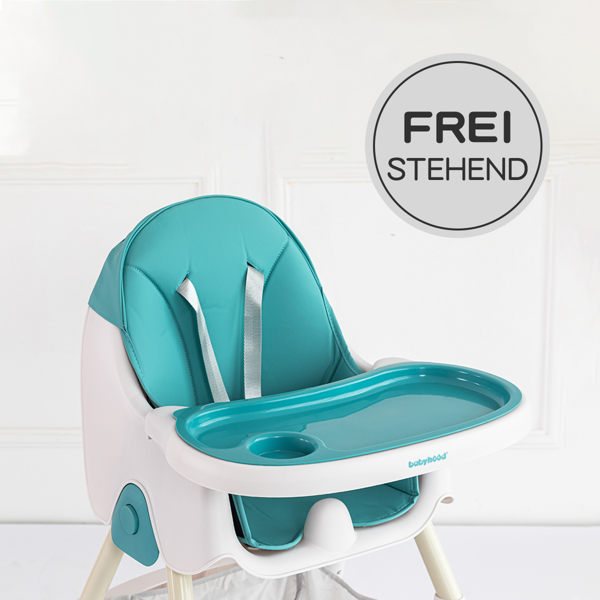 Babyhochstuhl mit tealfarbenem Sitz und Tablett, weißem Rahmen und Text: FREI STEHEND.