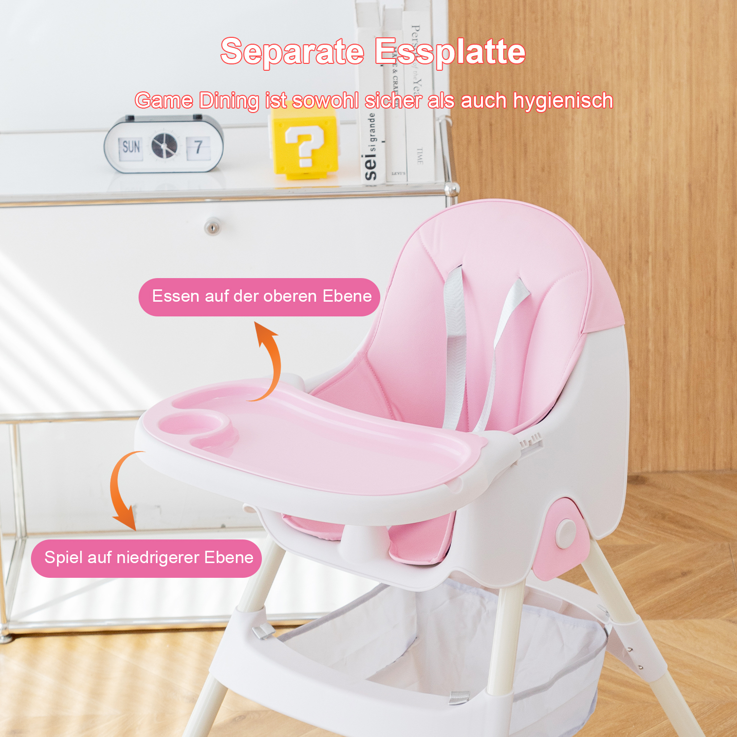 Rosa-weißer Hochstuhl. Tablett für Essen oben, Spiel unten.