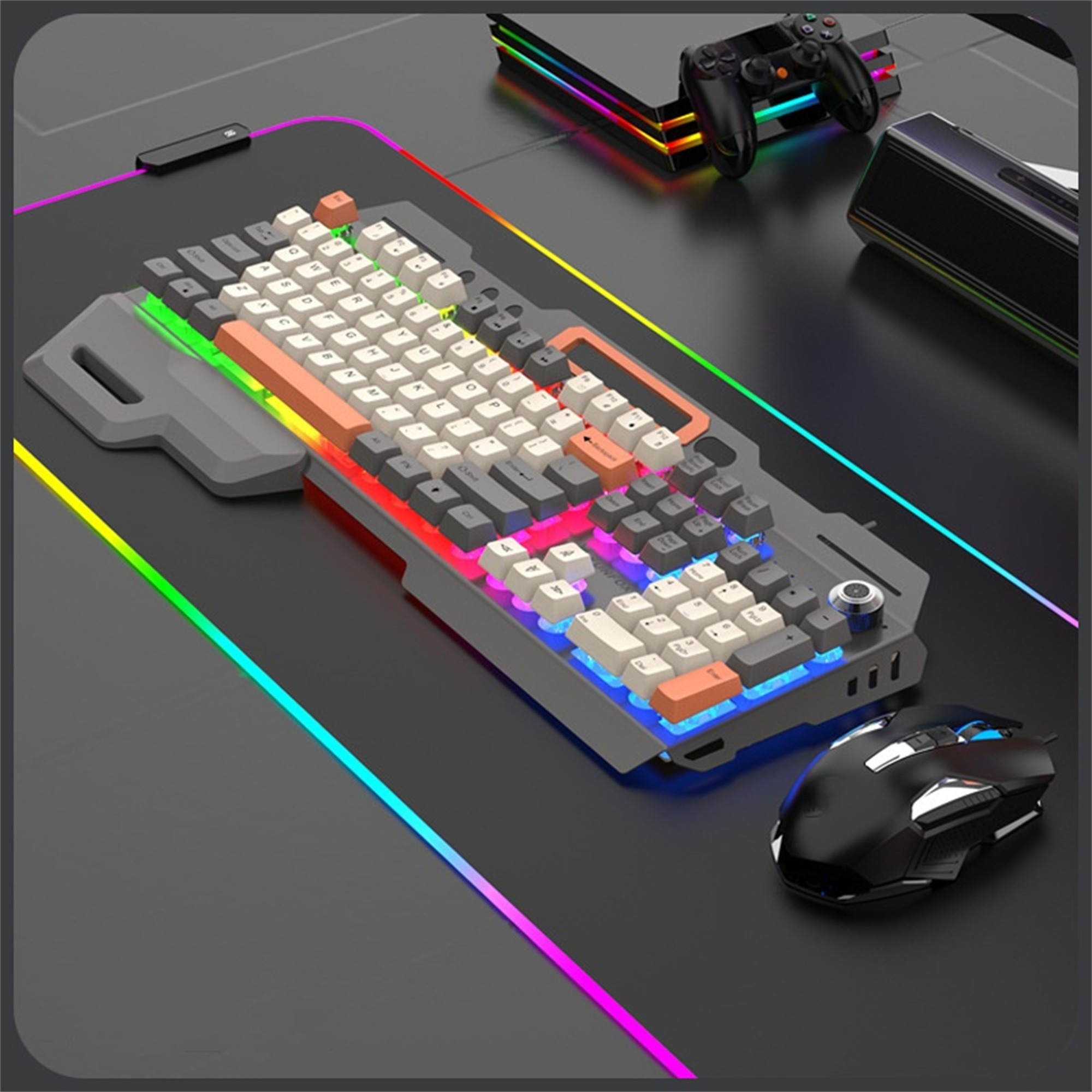 Gaming-Setup mit Tastatur, Maus, Controller und einem mehrfarbig LED-beleuchteten Schreibtisch. Hintergrund: Konsole.