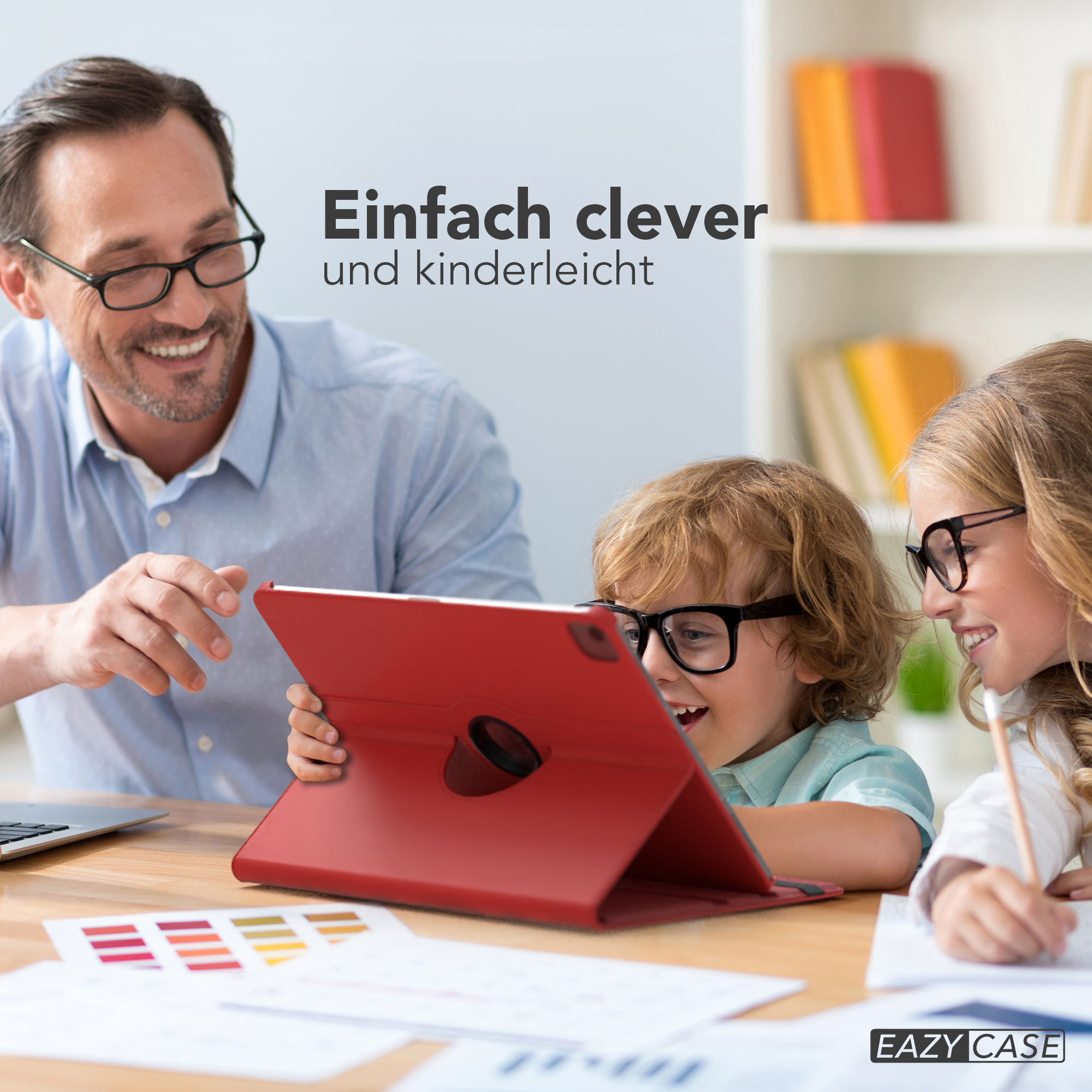Ein Vater und zwei Kinder benutzen ein Tablet. Das Tablet ist rot. Lächeln und Brillen.
