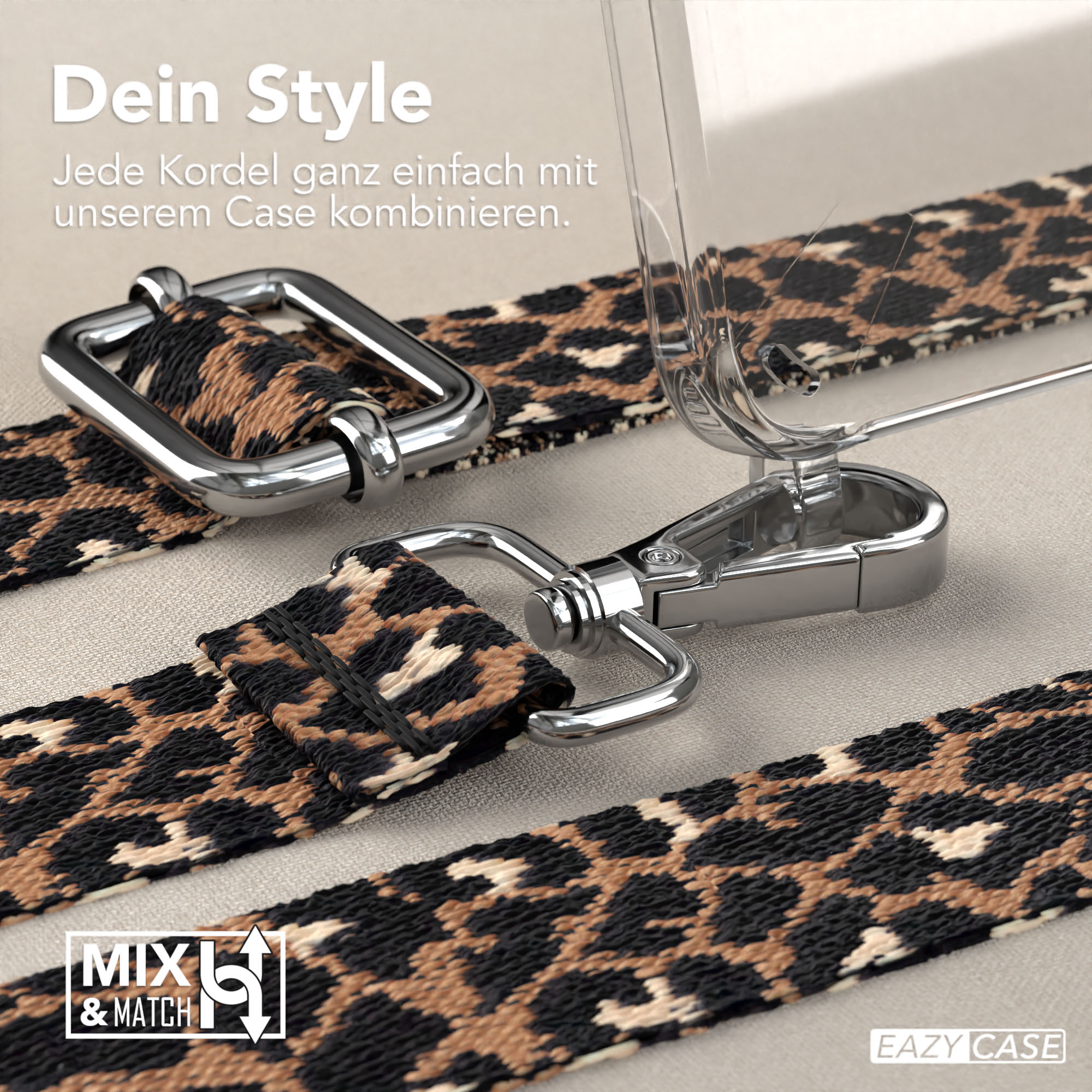 Nahaufnahme eines Leopardenmuster-Gurts mit Handyhülle und Metallverschlüssen. Beiger Hintergrund.