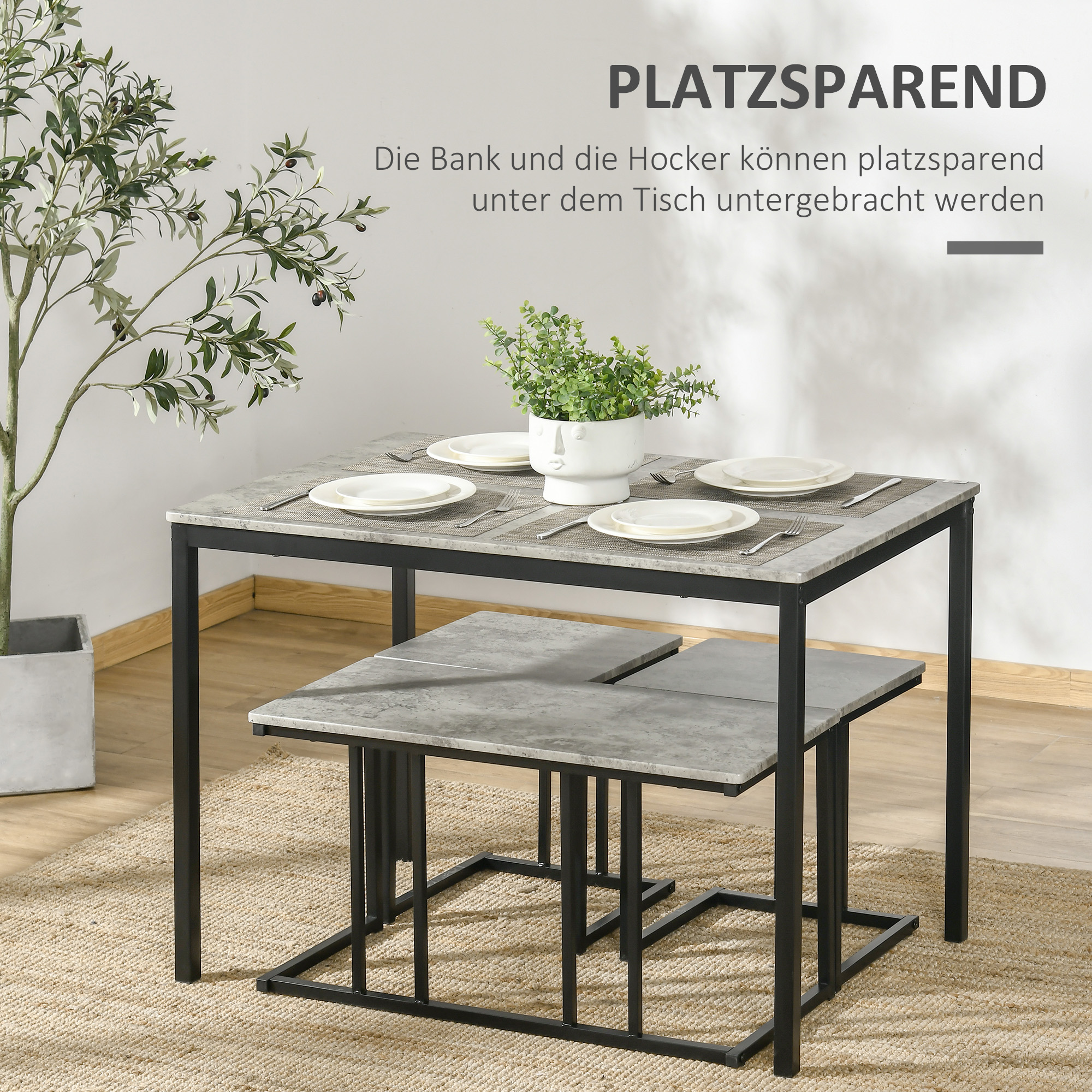 Esstisch und Hocker. Tisch ist grau mit schwarzen Beinen. Text sagt: Platzsparend.