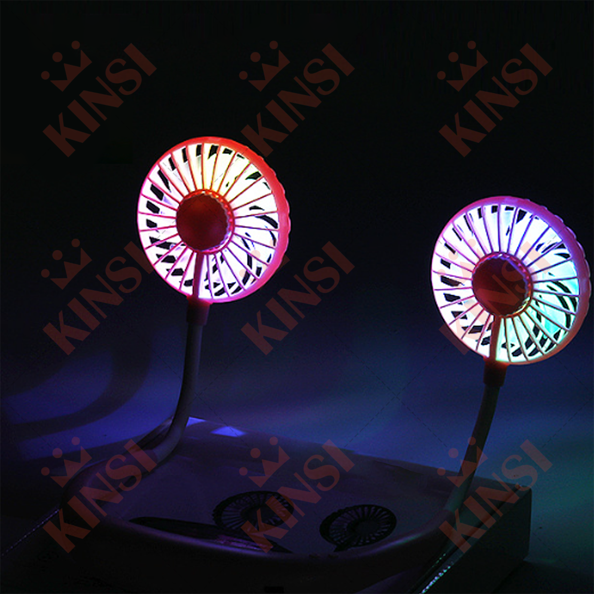 Zwei Nackenventilatoren, beleuchtet, mit mehreren Farben, auf weißer Oberfläche, dunkler Hintergrund.