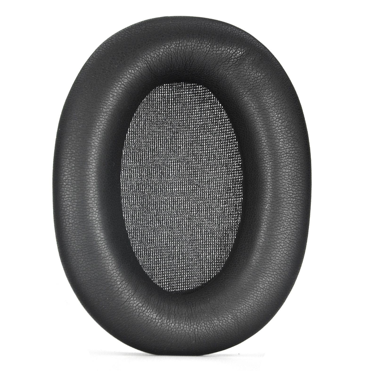 Un cuscinetto auricolare nero a forma ovale per cuffie, che mostra la maglia interna.