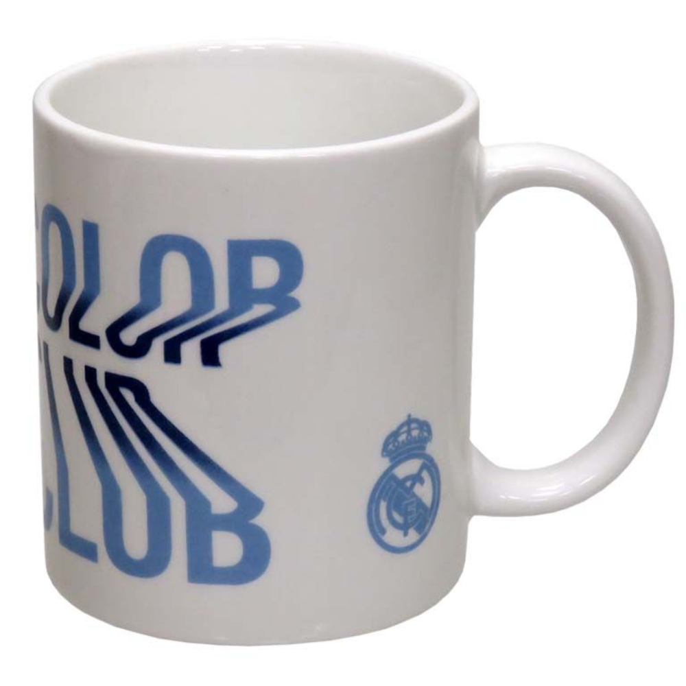 Taza blanca con el logo del club Real Madrid y texto.