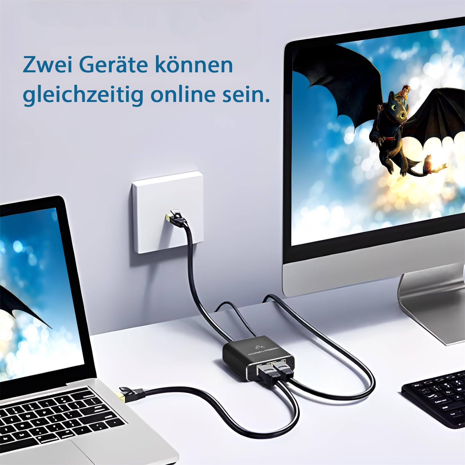 Zwei Computer sind mit einem Netzwerkkabel verbunden, mit einem schwarzen Gerät und einem Monitor mit Drachengrafik.