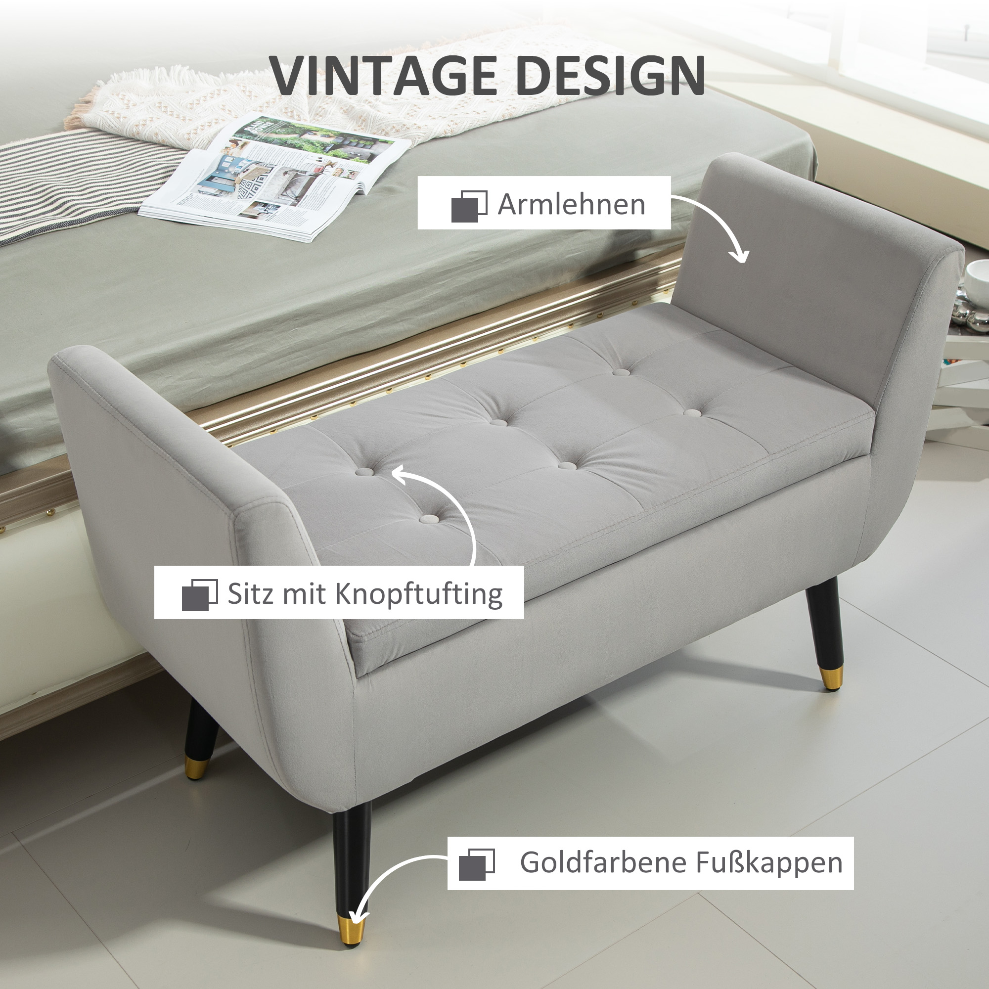 Eine graue Bank mit Armlehnen, Knopfheftung und goldenen Füßen, mit dem Text 'Vintage Design'.