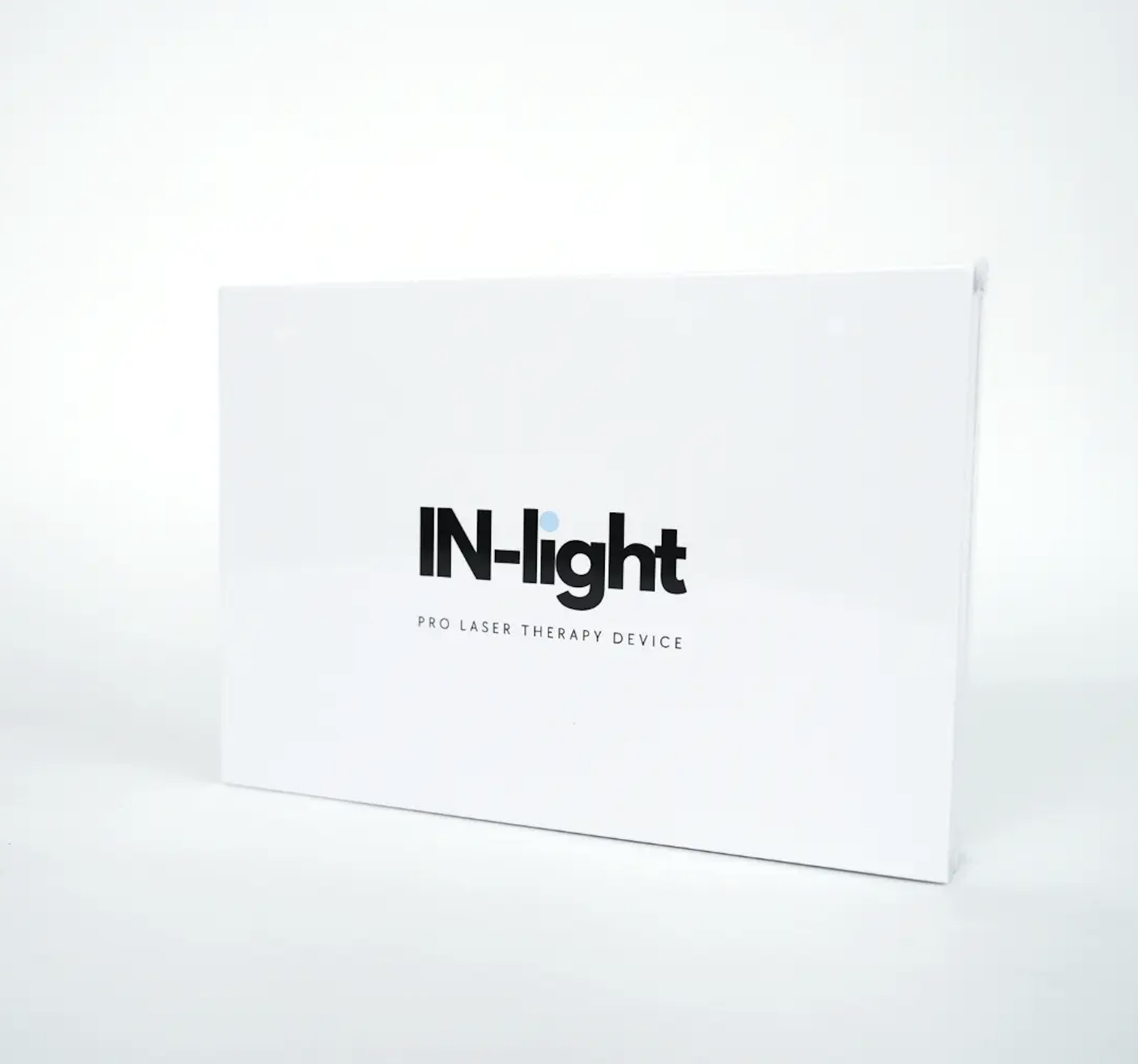 Eine weiße Box mit 'IN-light'-Logo, die ein Pro-Lasertherapiegerät anzeigt.