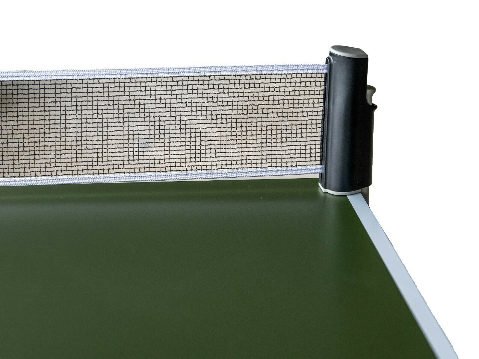 Ping pong net with a black and white post. Green surface, white background.
