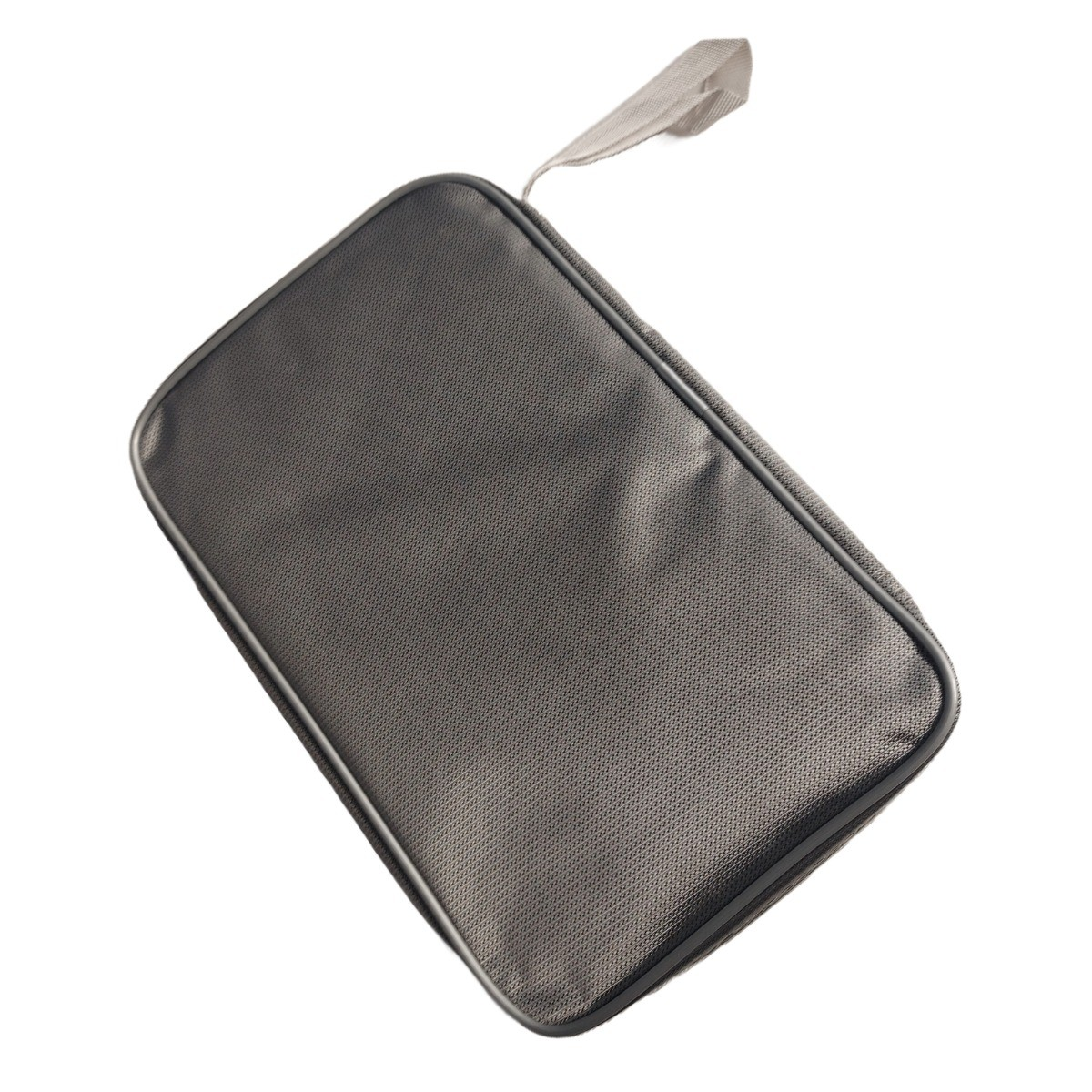 A gray zipped bag with a handle, lying on a white surface.