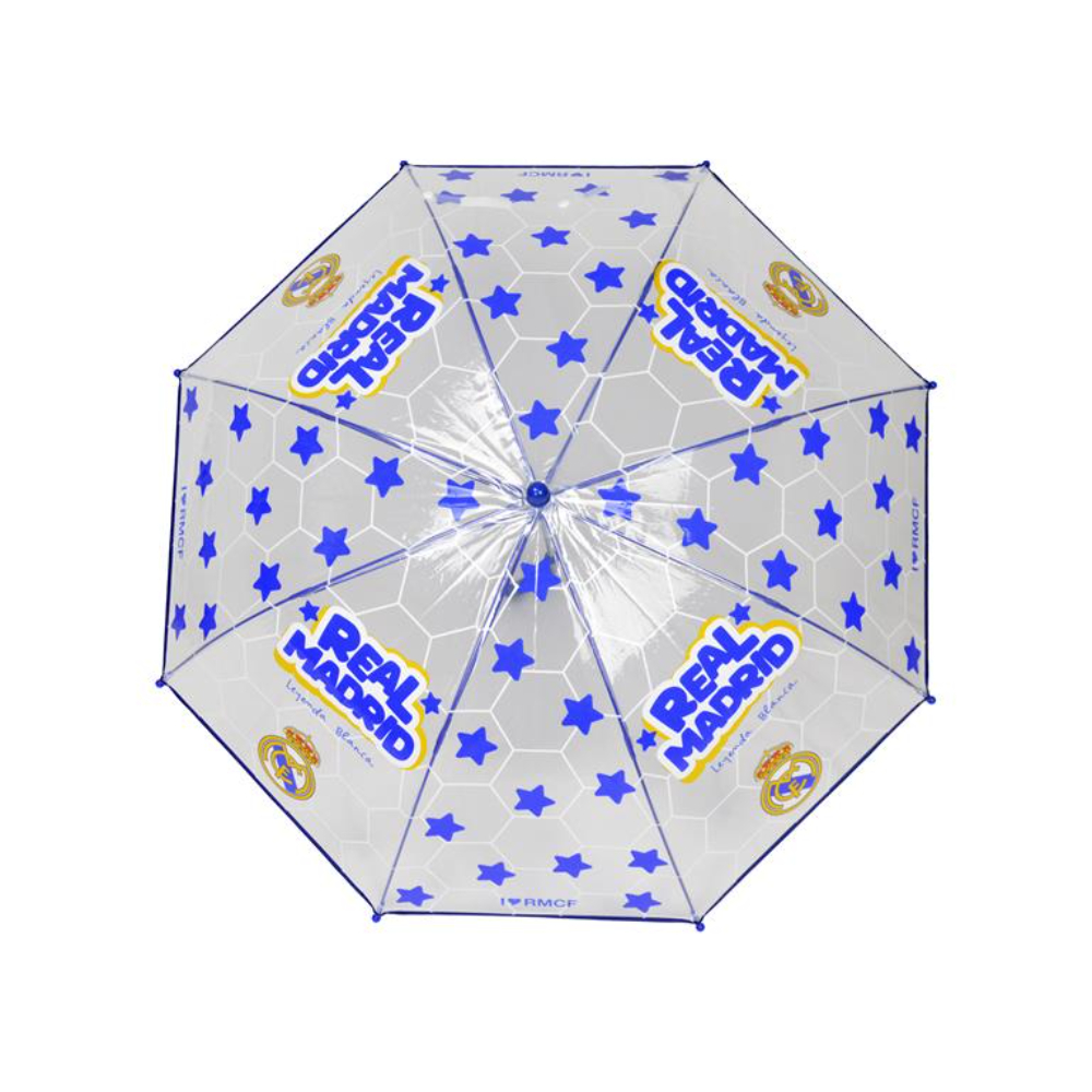 Paraguas transparente del Real Madrid con estrellas azules y el logo del equipo. Está abierto, mostrando el diseño sobre una superficie blanca.