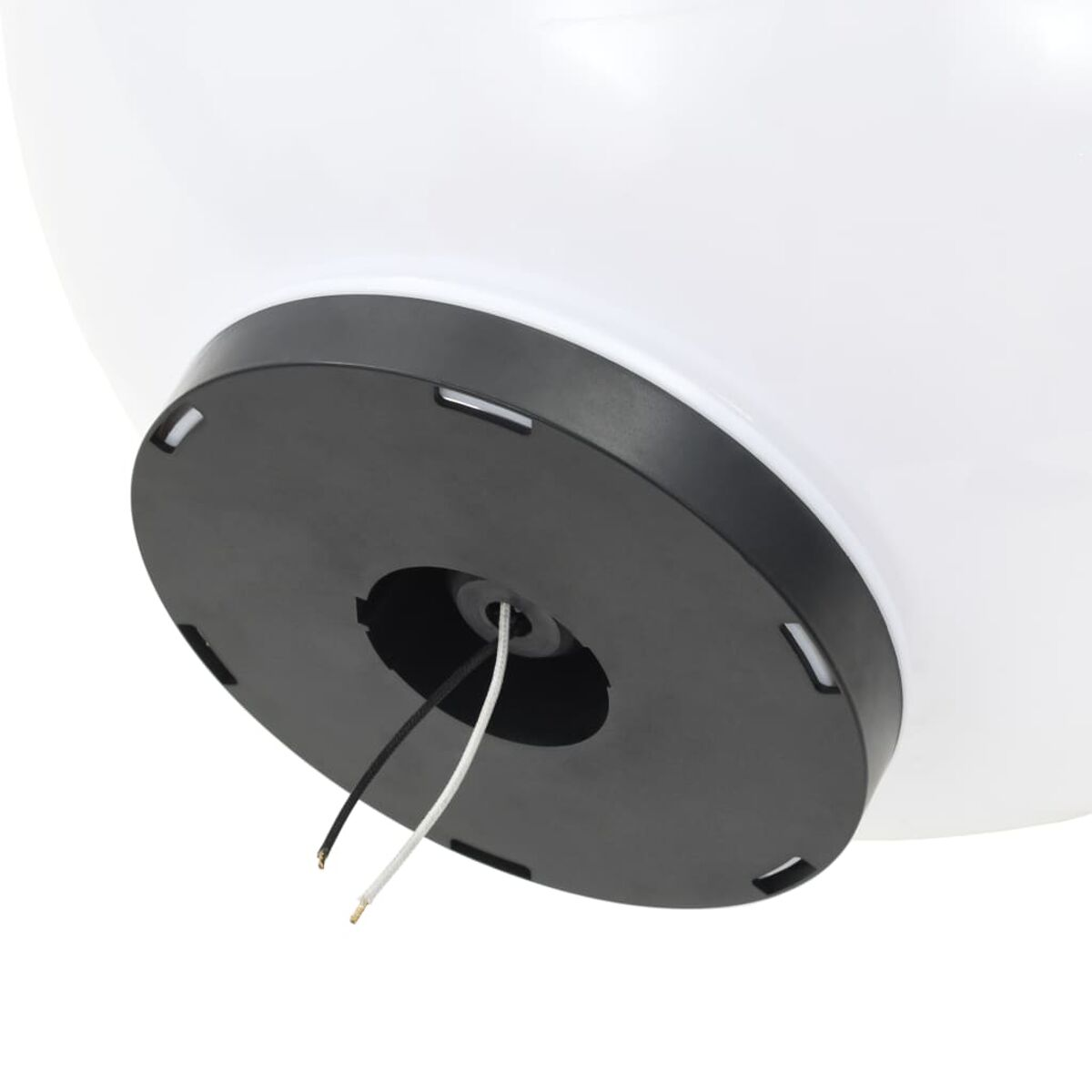 Un apparecchio di illuminazione bianco e rotondo con base nera, che mostra fili e un'apertura centrale.