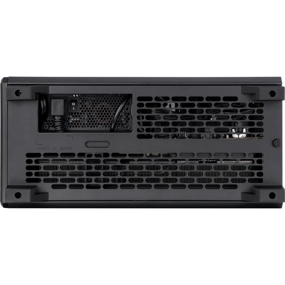 Black computer case with ventilation holes and ports, seen from below.
