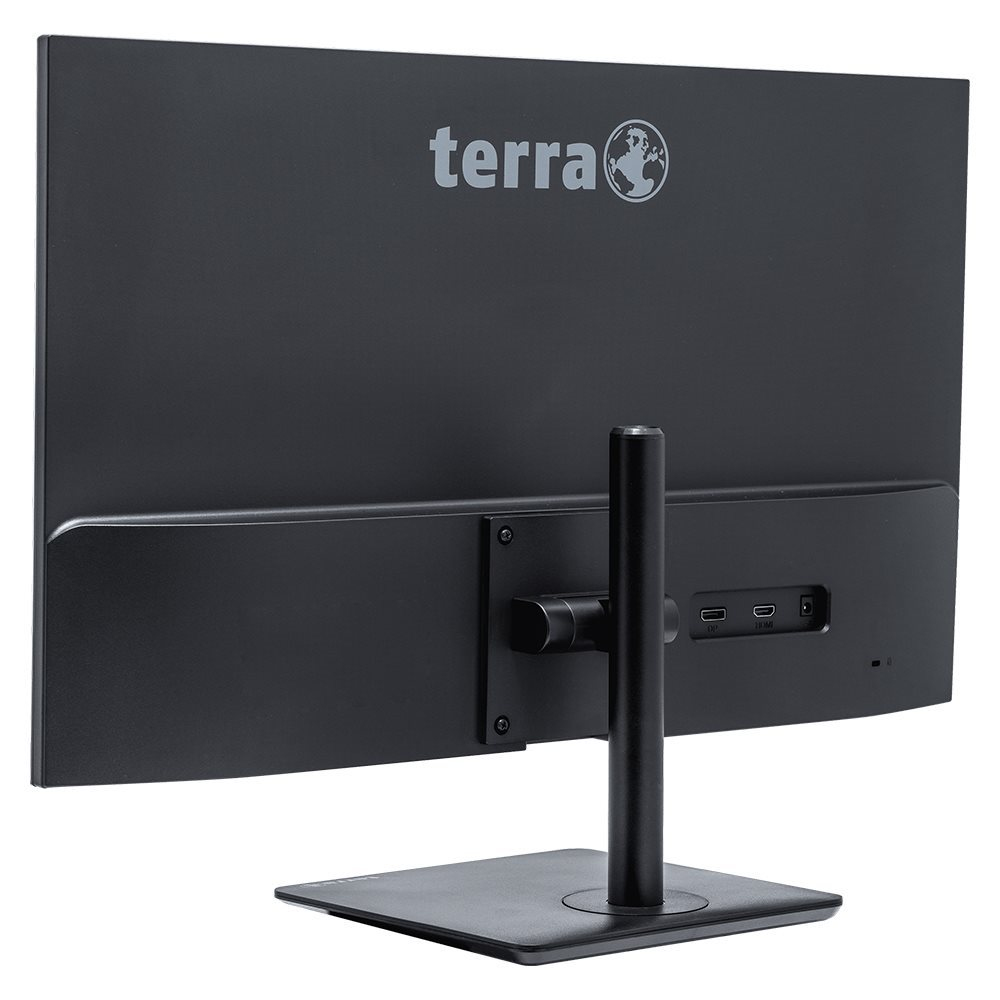 Vista trasera de un monitor de ordenador negro con soporte. Tiene puertos y la marca terra en la parte superior.