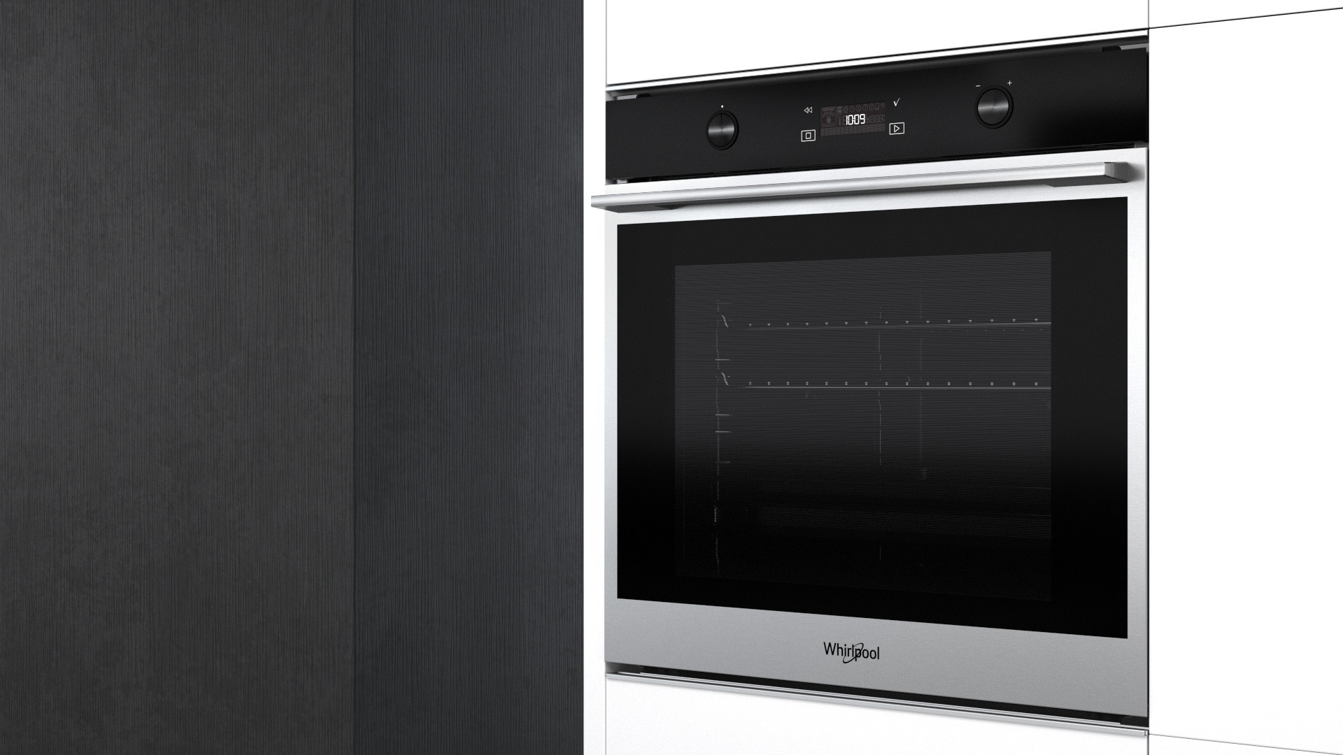 Forno con porta nera e finitura in acciaio inox. Logo Whirlpool. Design a incasso.