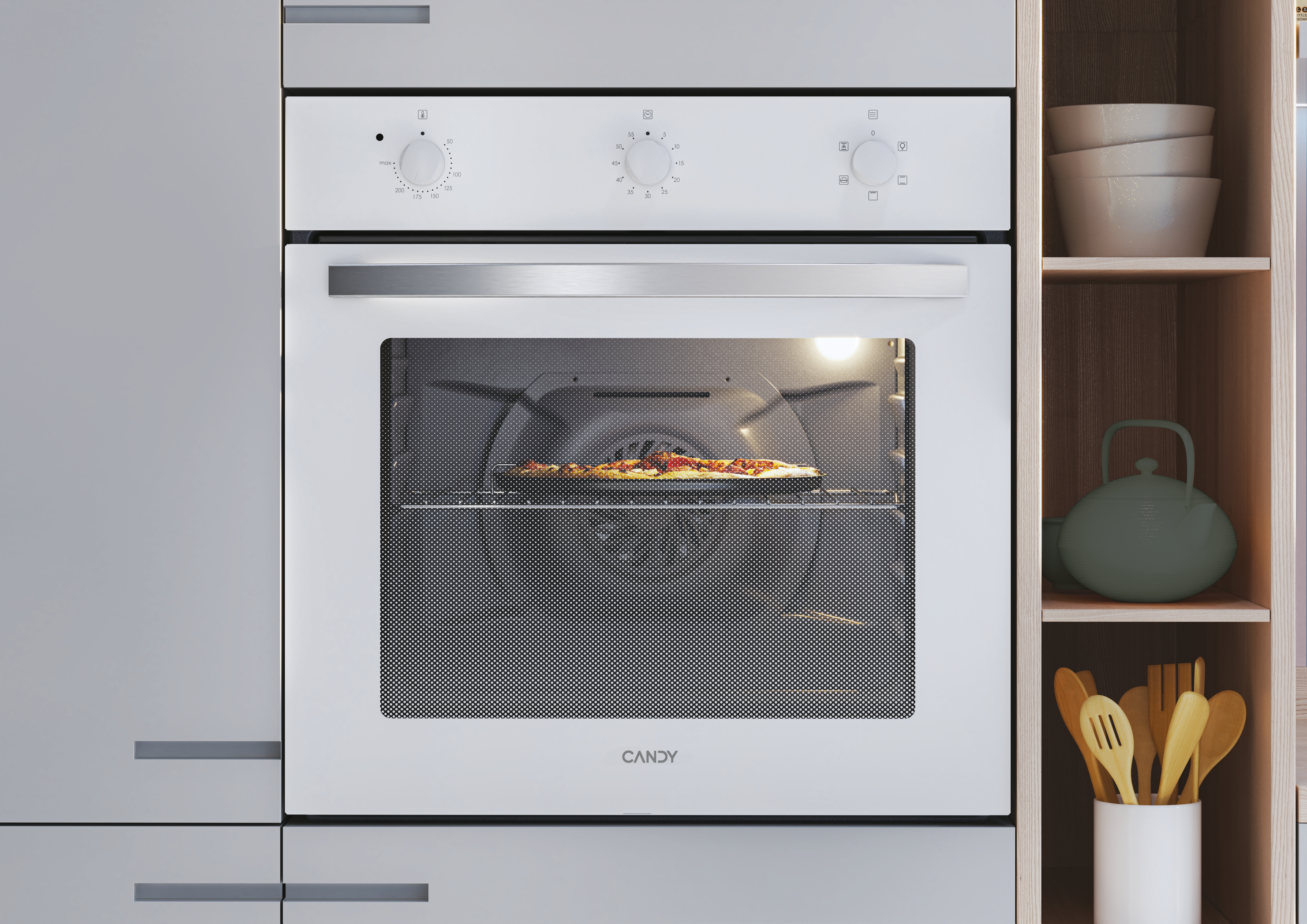 Un forno bianco con una pizza all'interno, in un mobile da cucina.
