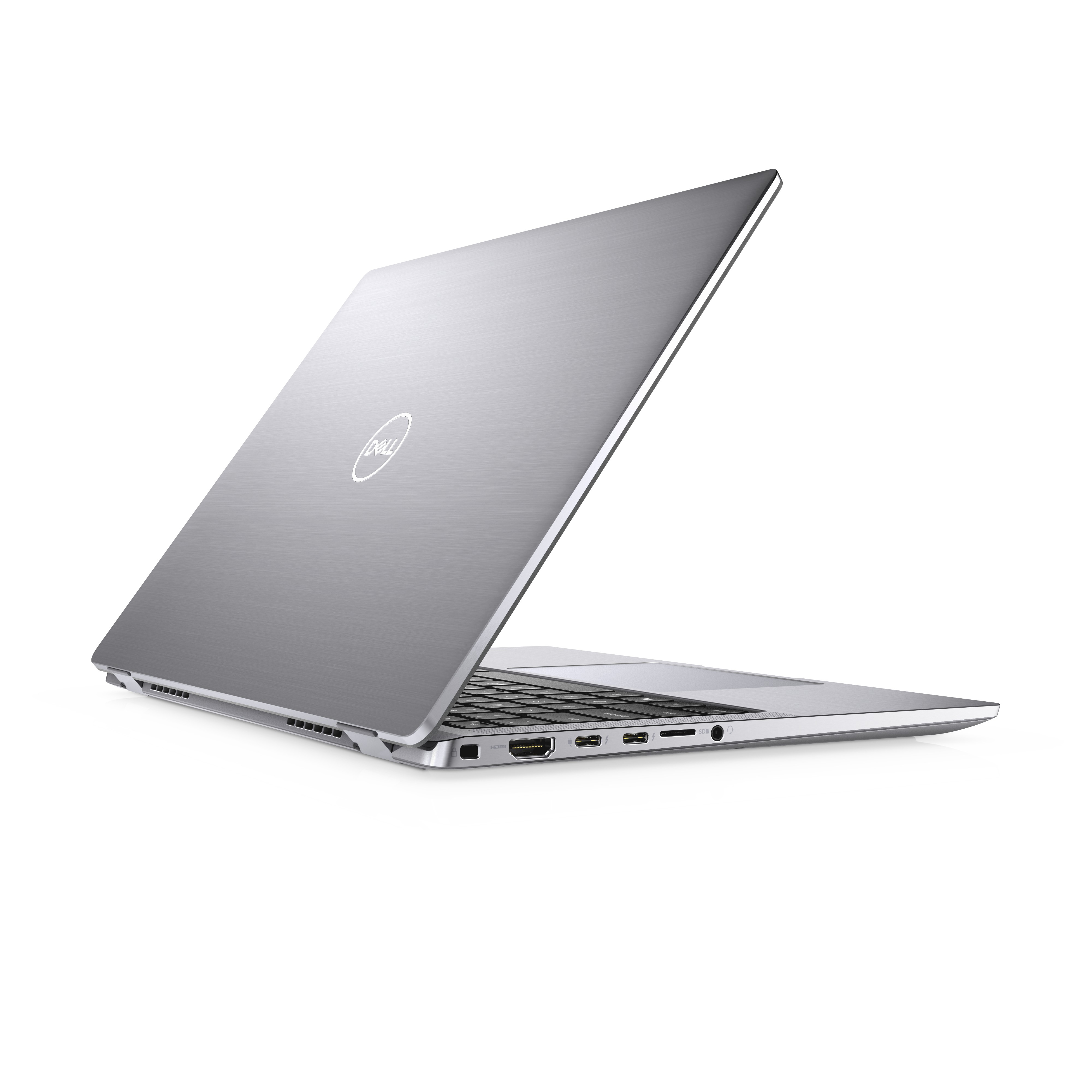 Vista laterale di un laptop Dell aperto, argentato, che mostra le porte sul lato e il logo Dell sulla cover.