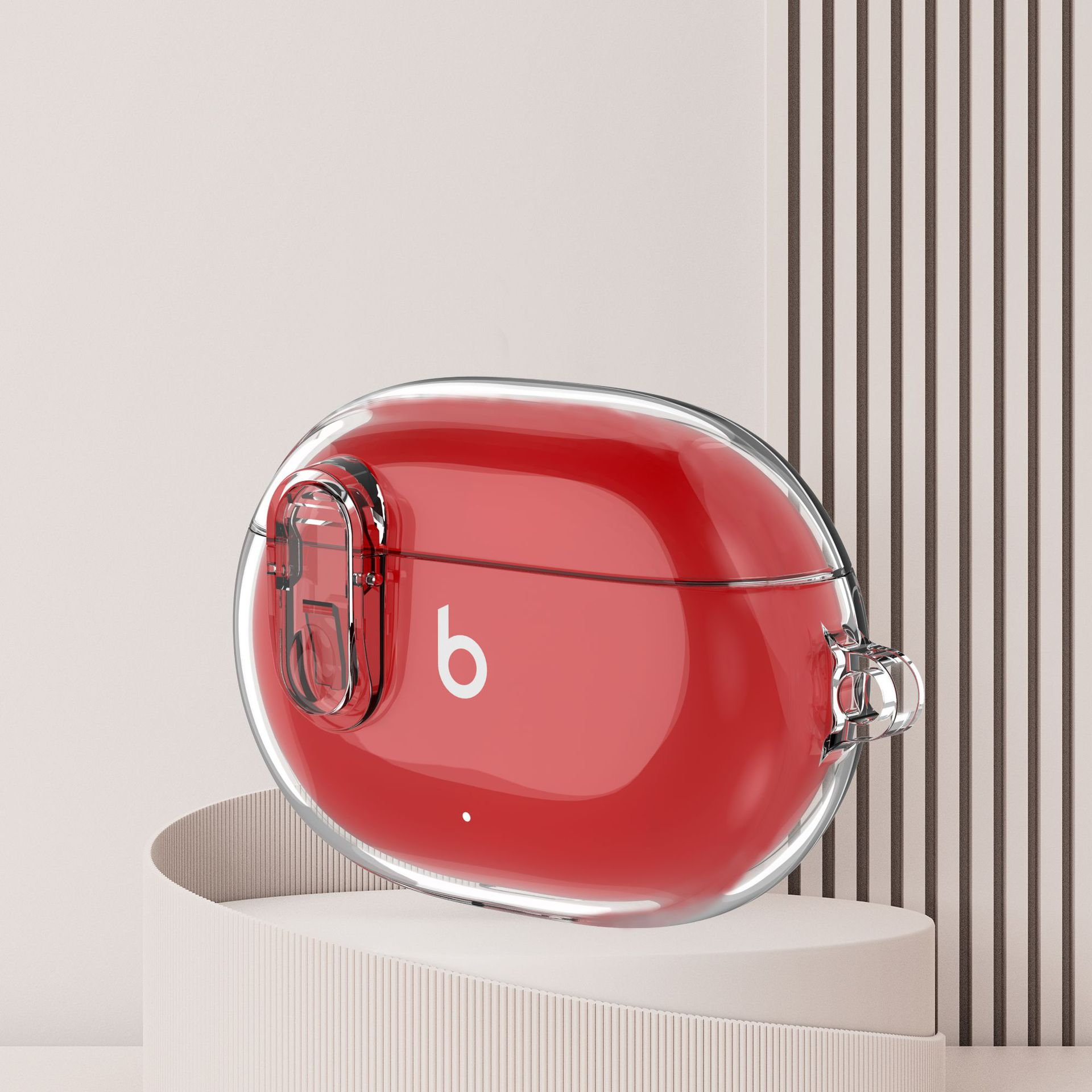 Custodia rossa per auricolari Beats, trasparente con logo 'b' bianco, su un piedistallo bianco.