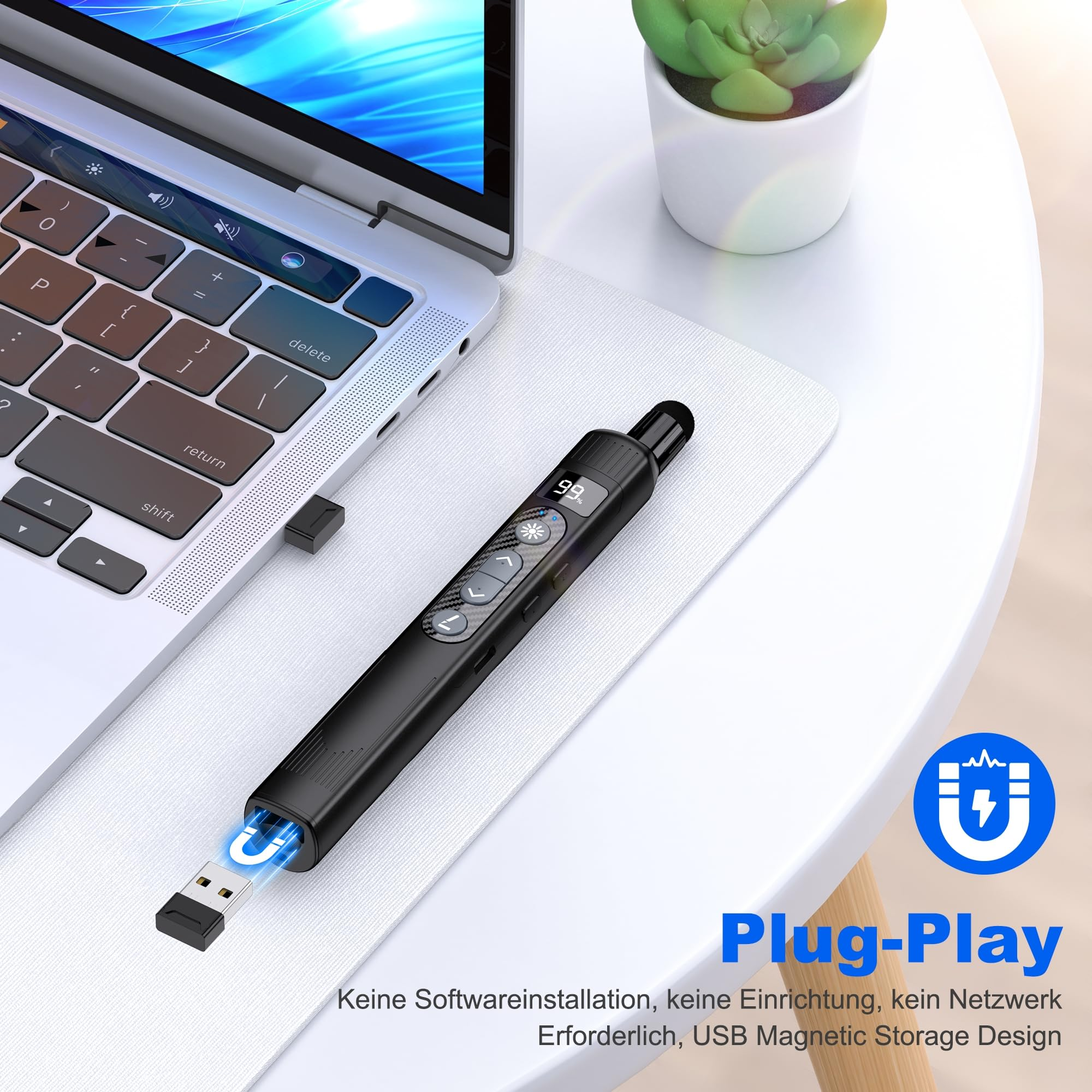 Schwarzes stiftähnliches Gerät mit USB-Anschluss und Laptop mit Mauspad.
