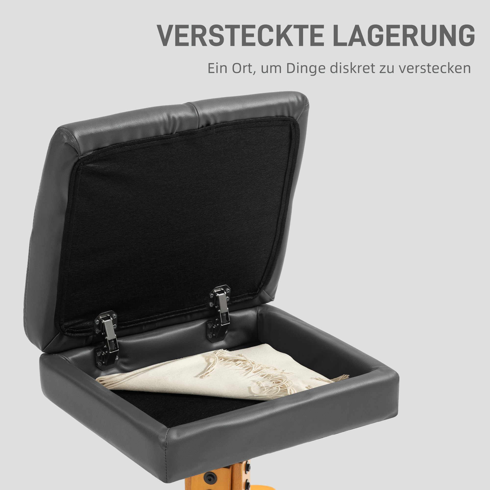 Eine graue Bank mit einem versteckten Staufach. Es enthält einen weißen Schal. Text: Versteckter Stauraum.