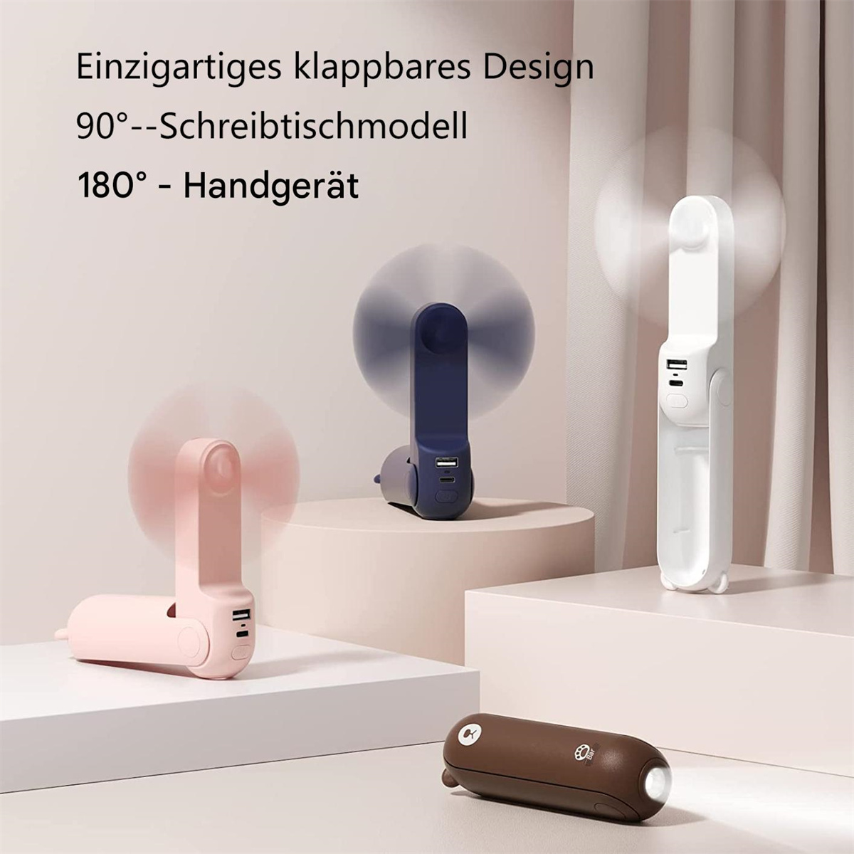 Eine Reihe von drei Ventilatoren, in Rosa, Blau und Weiß, mit einer braunen Taschenlampe.