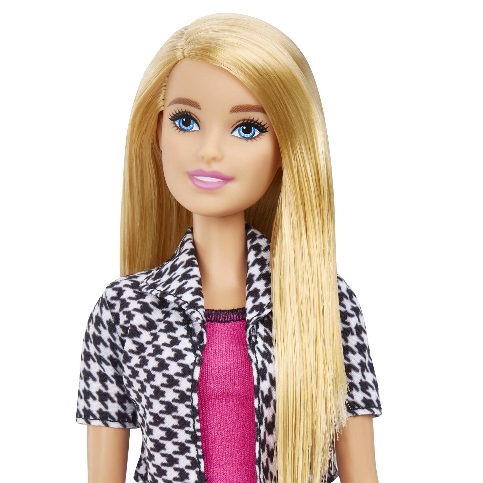 Eine blonde Barbie-Puppe mit blauen Augen, die eine schwarz-weiß gemusterte Jacke und ein rosa Oberteil trägt.