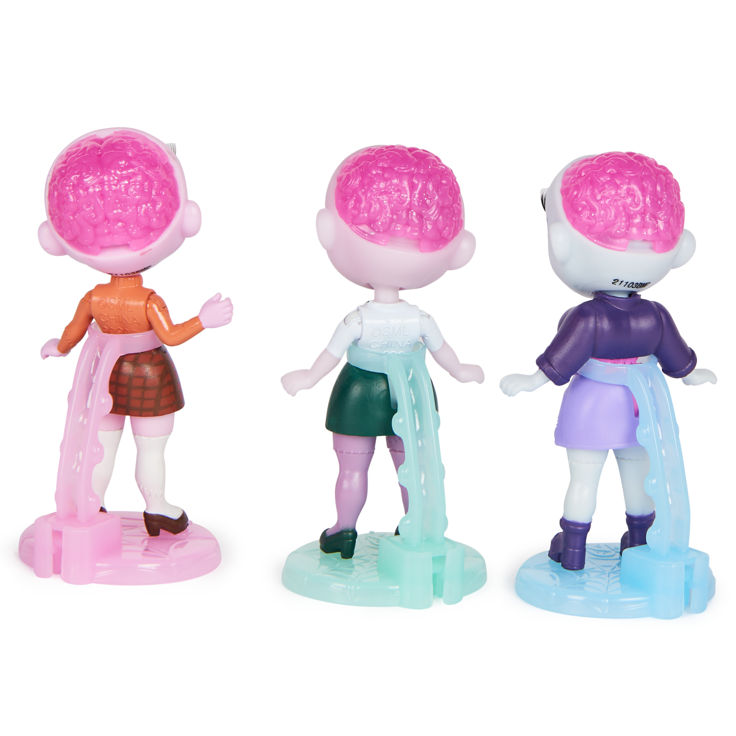 Tres muñecas con cerebros visibles. Cada muñeca tiene ropa de diferentes colores y una base rosa.
