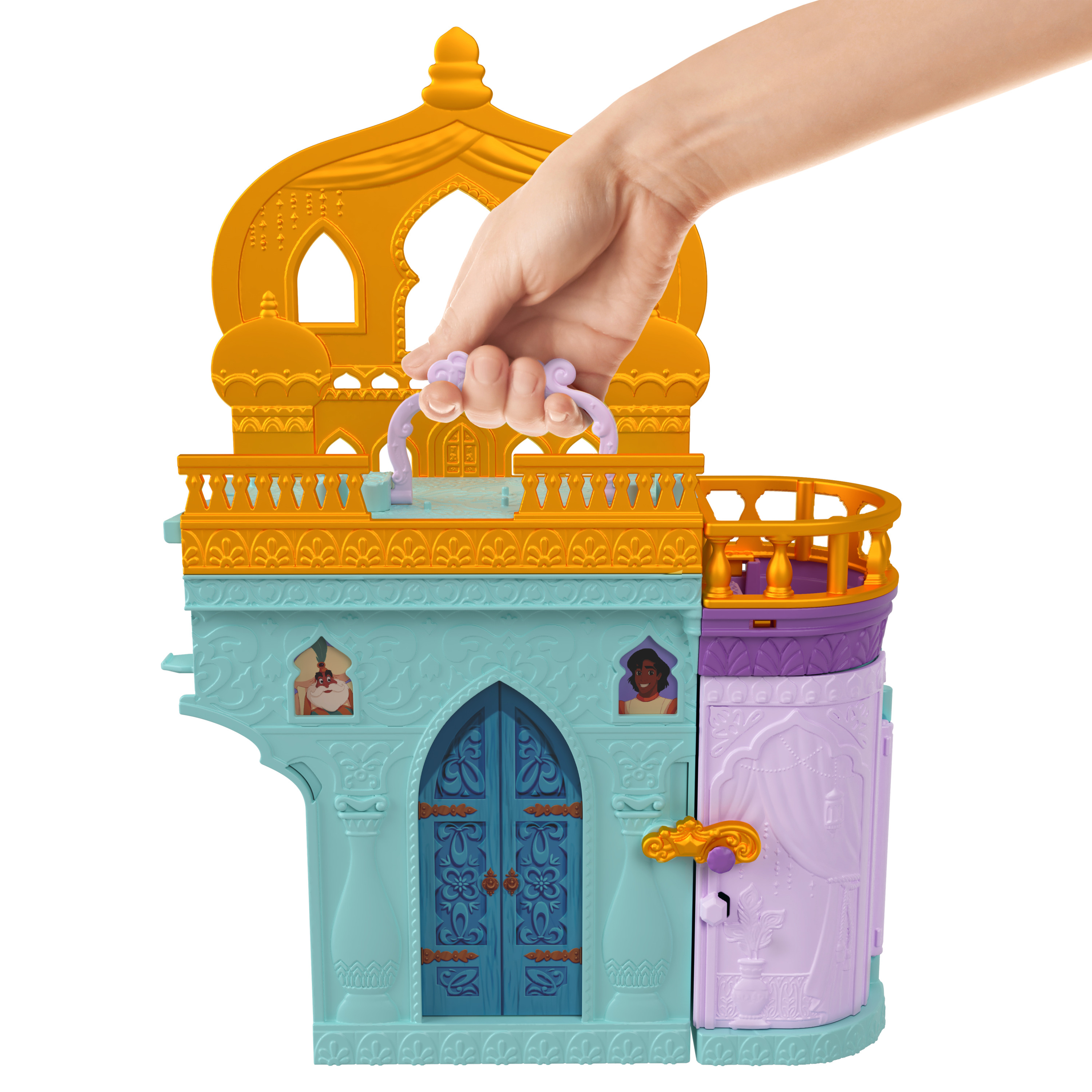 Eine Hand, die ein mehrfarbiges Spielzeugschloss mit goldenem Dach und blauen Türen hält.