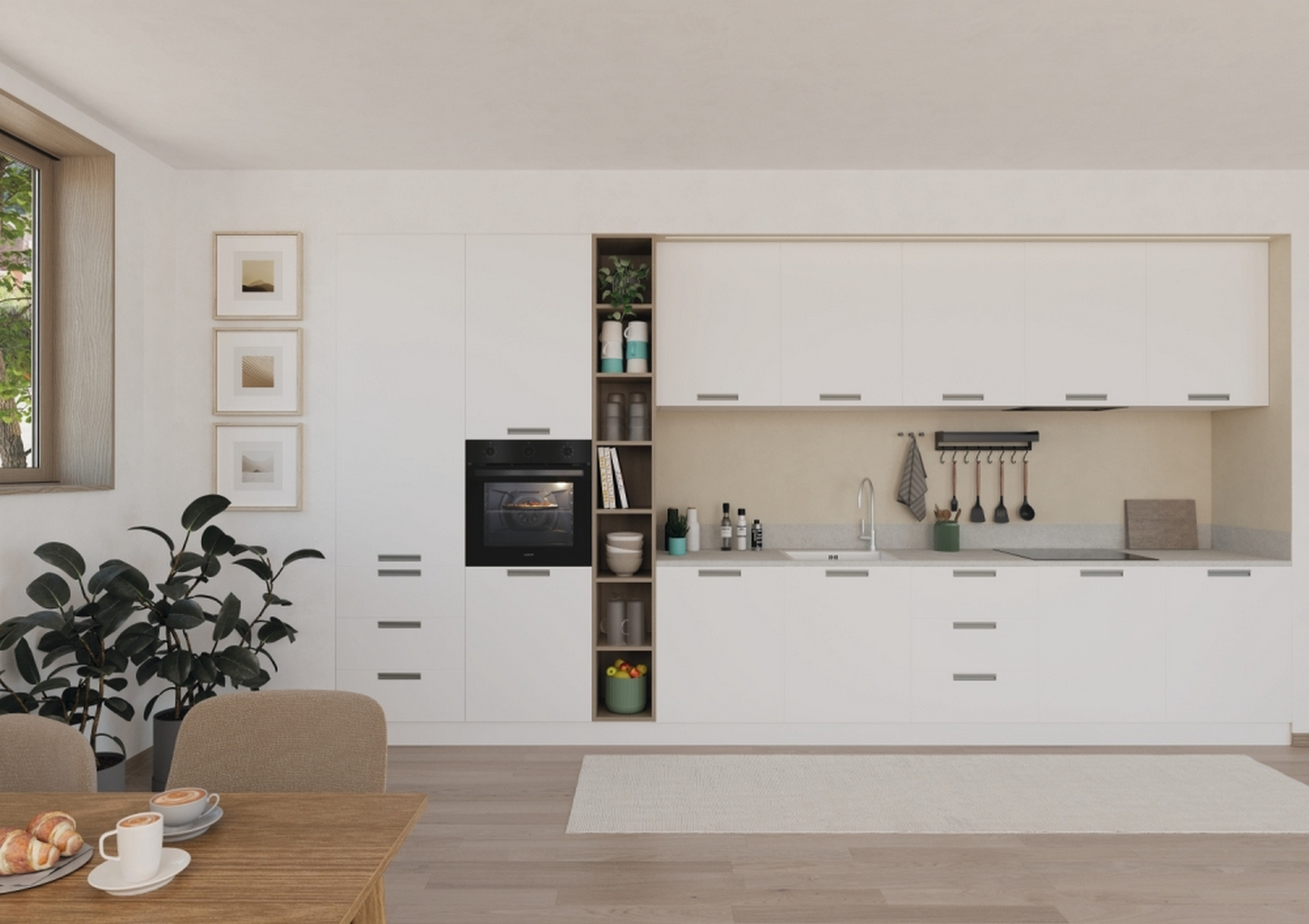Cucina moderna con mobili bianchi, forno e tavolo in legno.