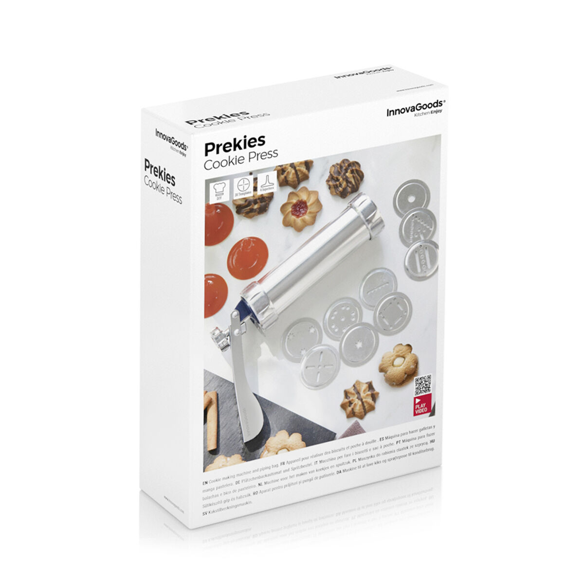 Scatola della pressa per biscotti con la pressa, le forme dei biscotti e le istruzioni. Sfondo bianco.