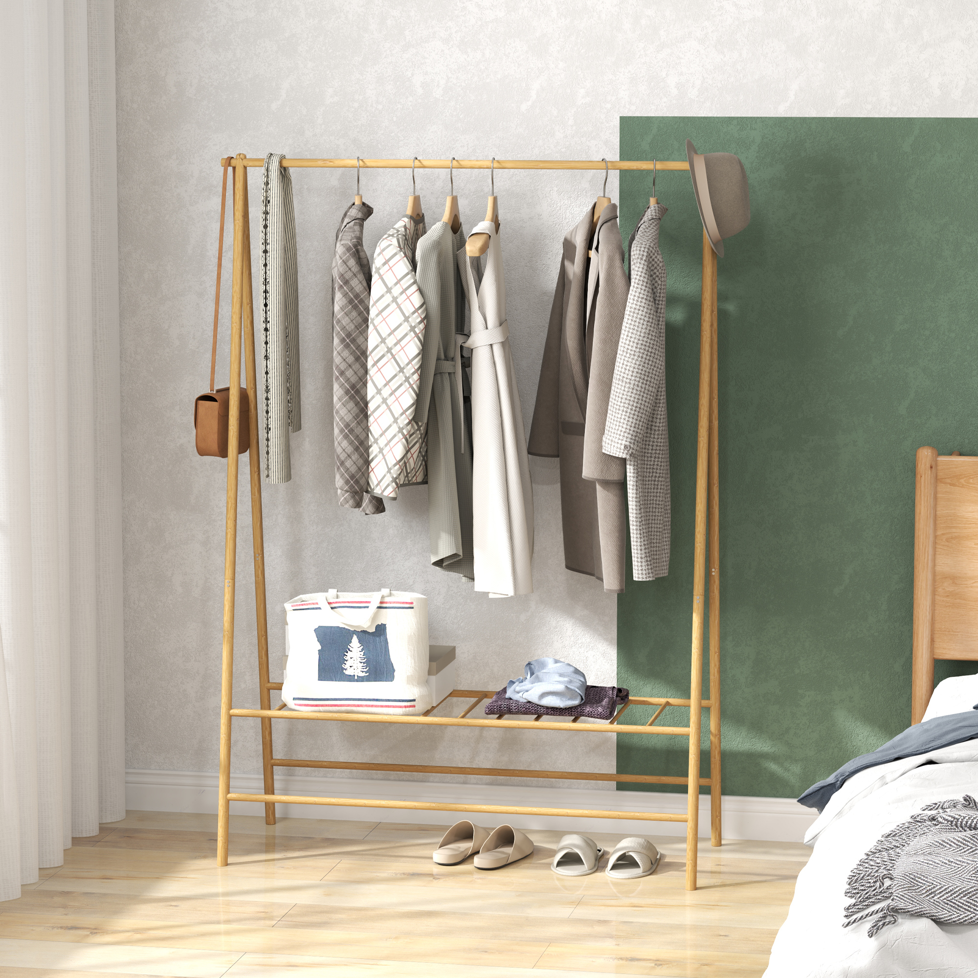 Ein hölzerner Kleiderständer mit Kleidung daran, neben einem Bett und einer grünen Wand.