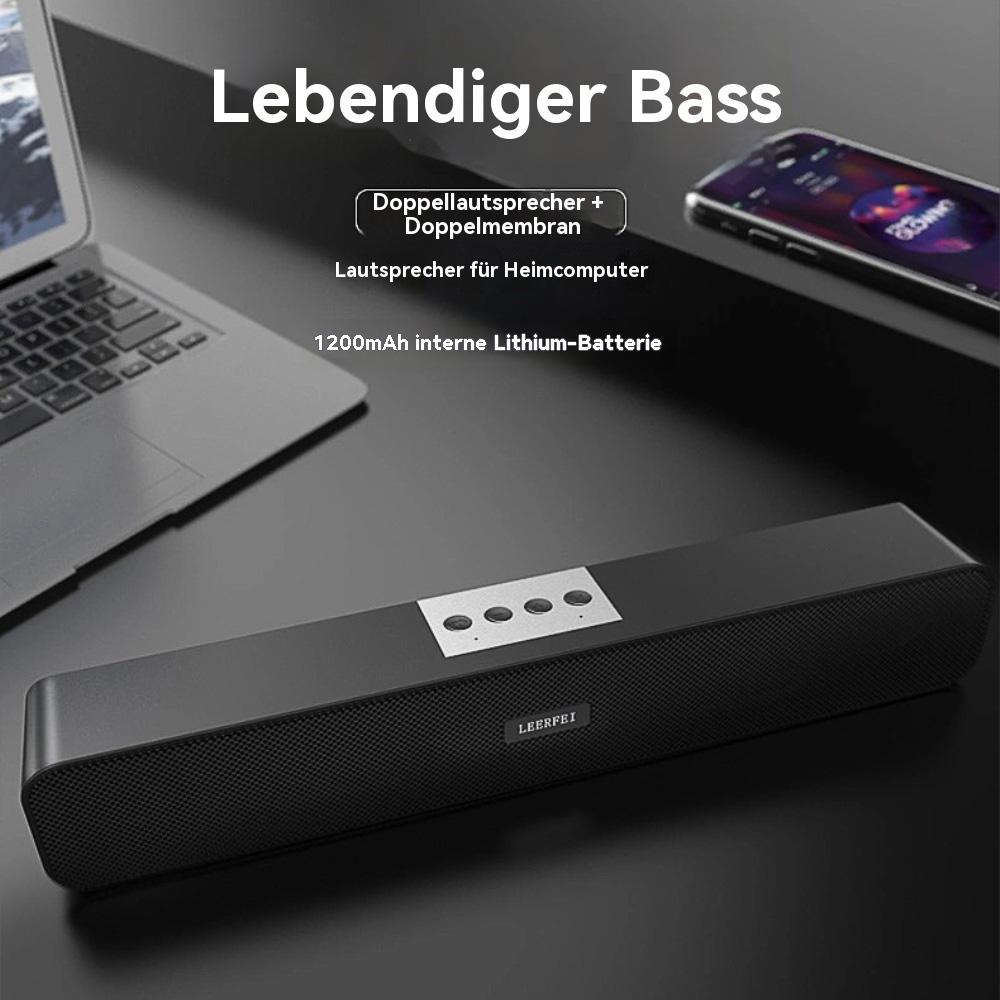 Schwarze Soundbar auf einem Schreibtisch, Laptop und Telefon. Text: 'Lebendiger Bass'.