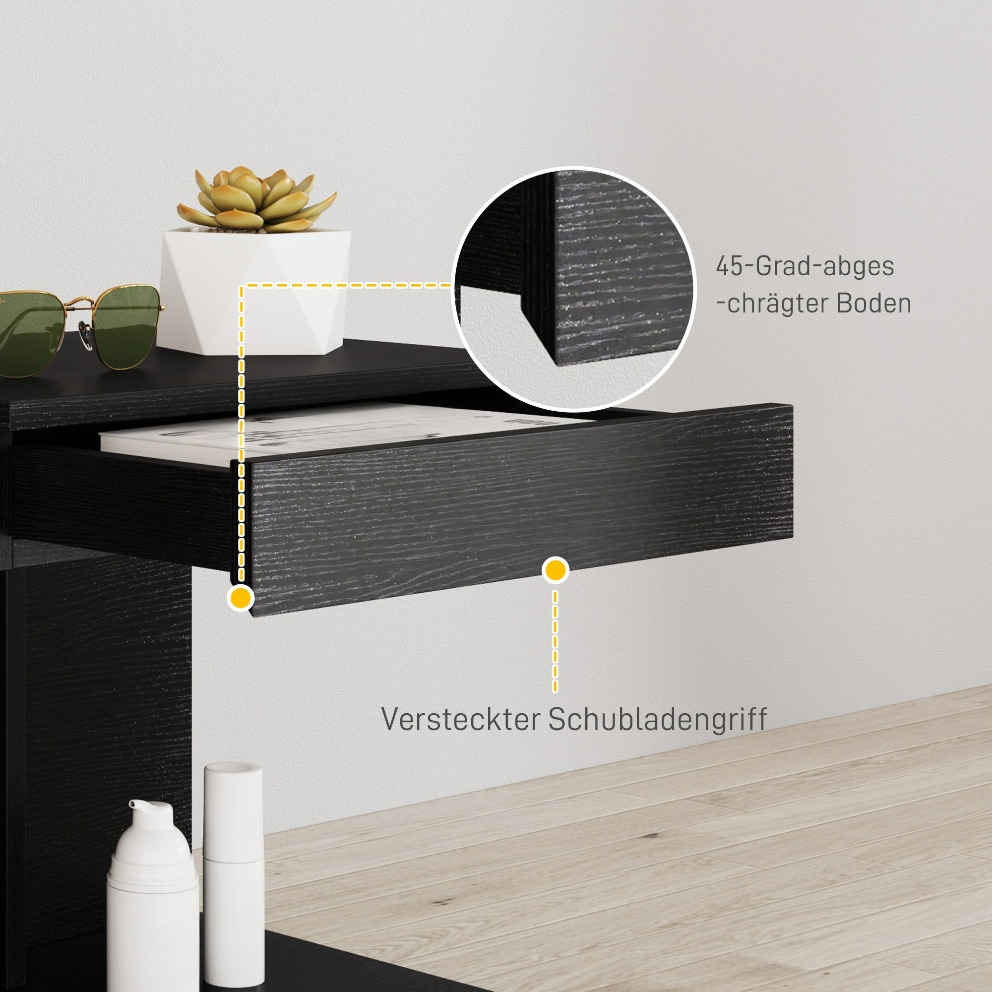 Schwarze schwebende Schublade mit Pflanze und Sonnenbrille. Detail zeigt abgeschrägte Kante.