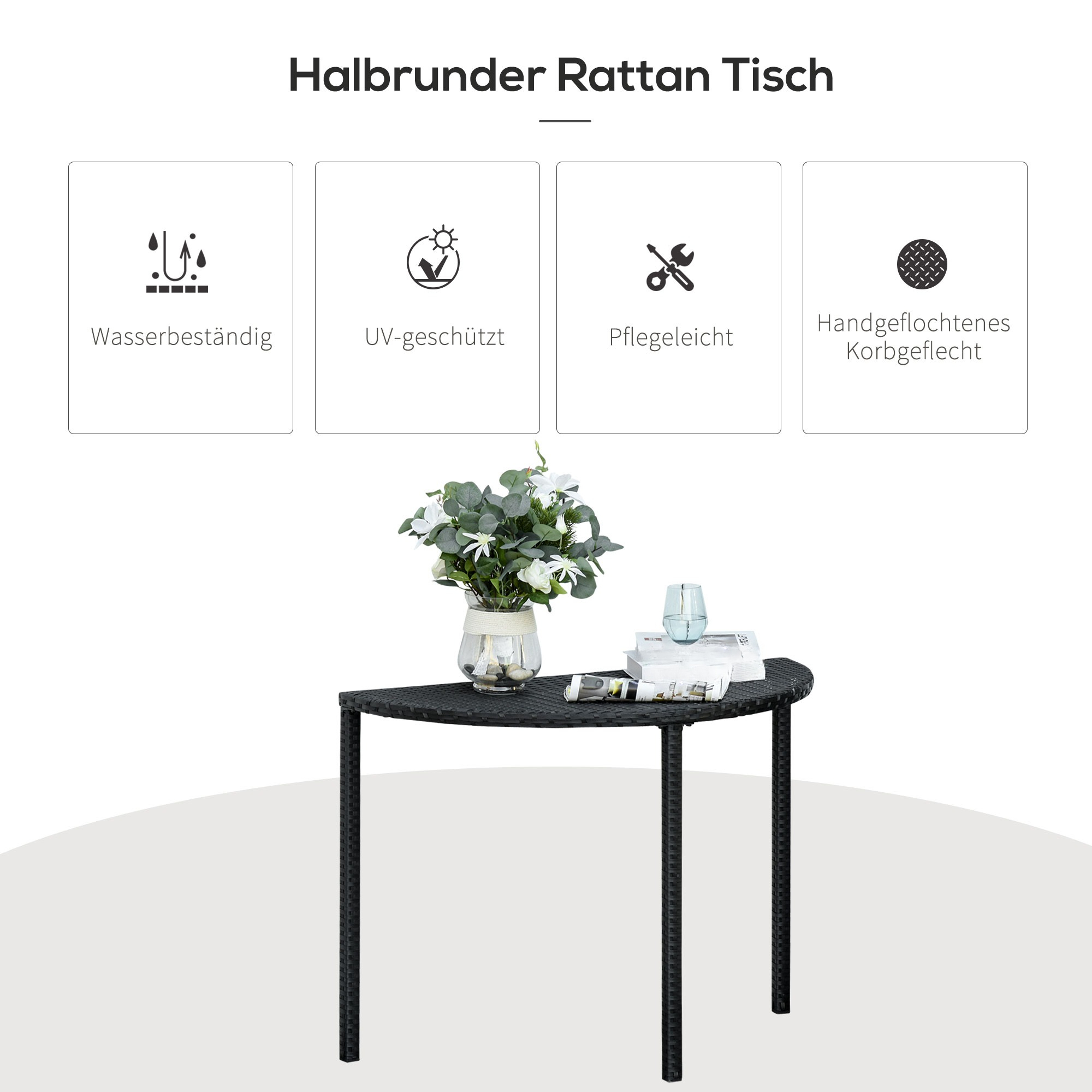 Ein schwarzer Rattan-Halbkreis-Tisch mit einer Blumenvase und Büchern darauf.