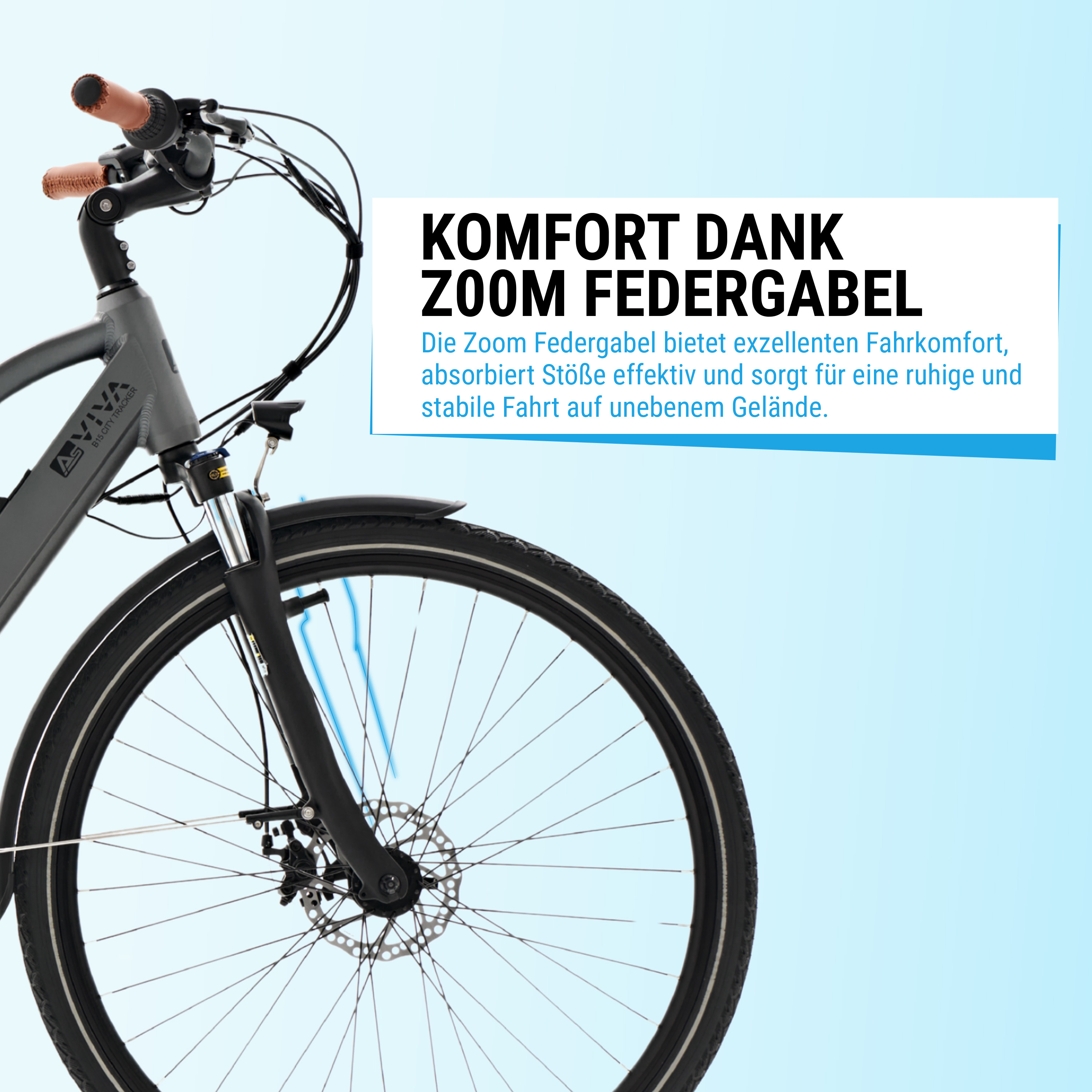 Nahaufnahme des Vorderrads eines grau-schwarzen Fahrrads. Text: Komfort dank ZOOM-Federgabel.