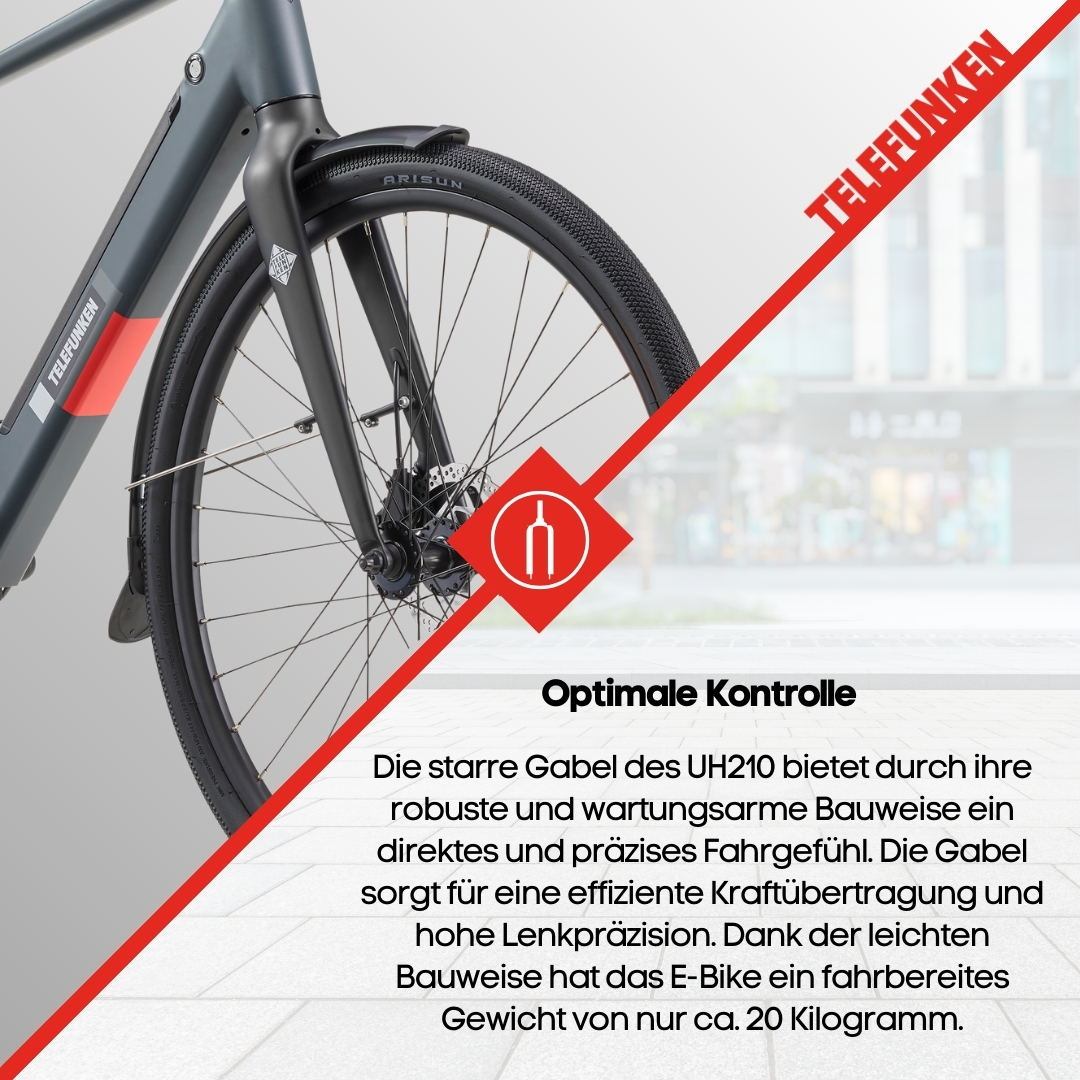 Nahaufnahme der Vorderseite eines grauen Telefunken E-Bikes. Es zeigt Vorderrad und Federung.