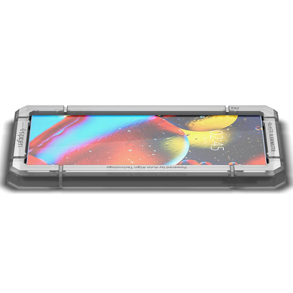 Telefon z osłoną ekranu i ramką wyrównującą. Telefon wyświetla kolorową grafikę.