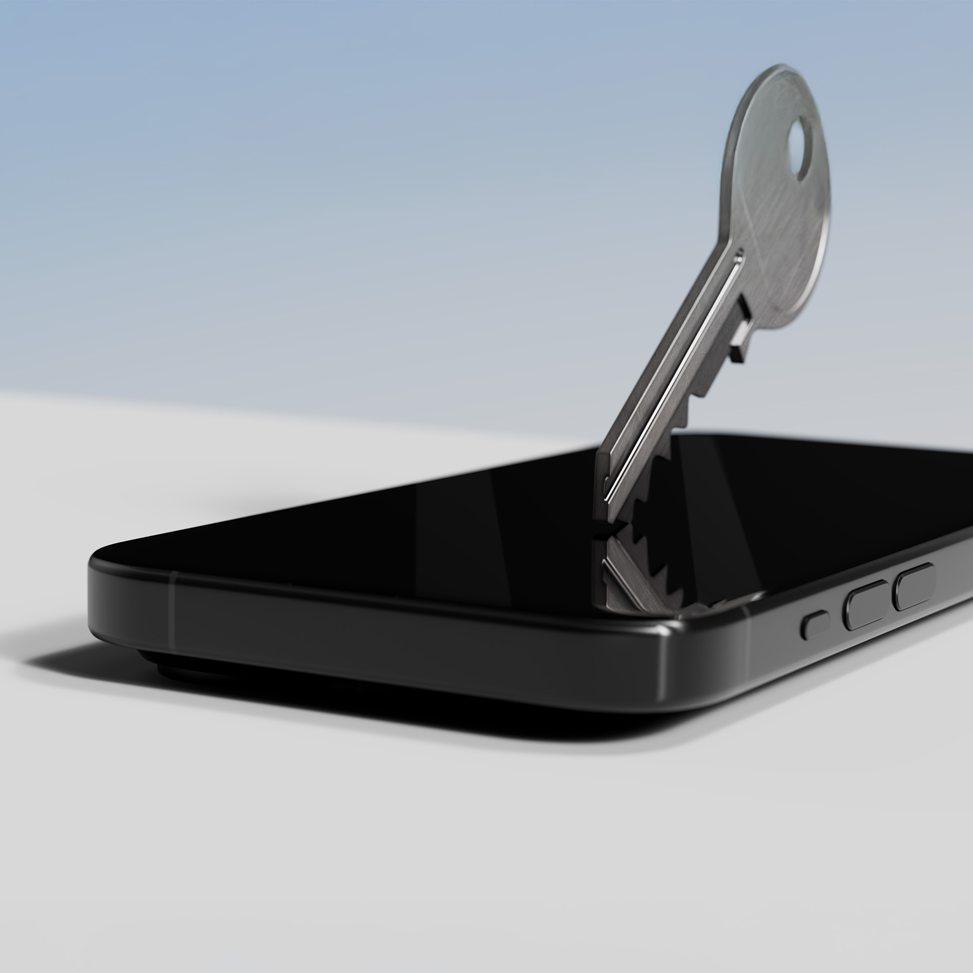 Czarny telefon z kluczem częściowo włożonym w ekran.