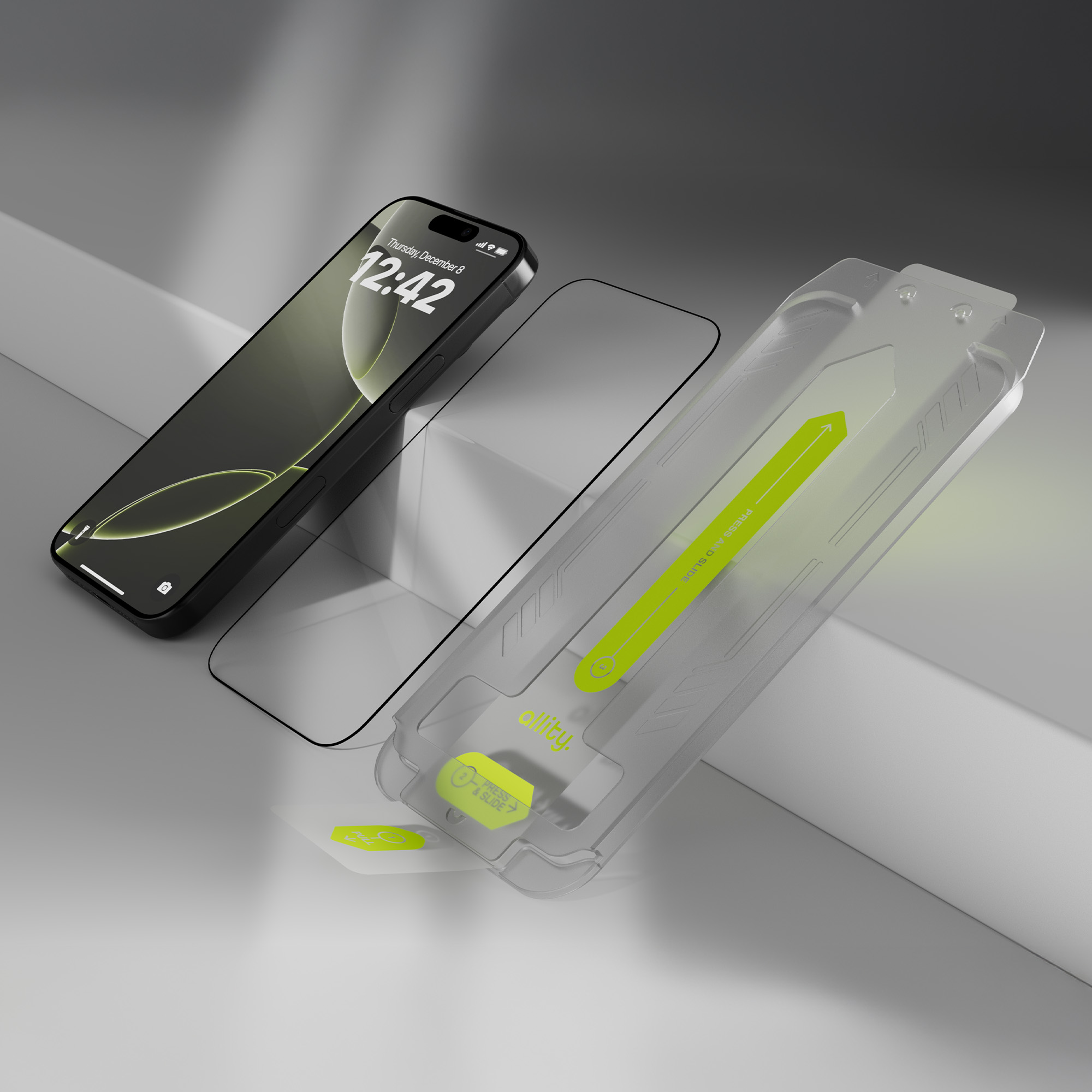 Telefon, ochrona ekranu i zestaw instalacyjny na białej powierzchni.