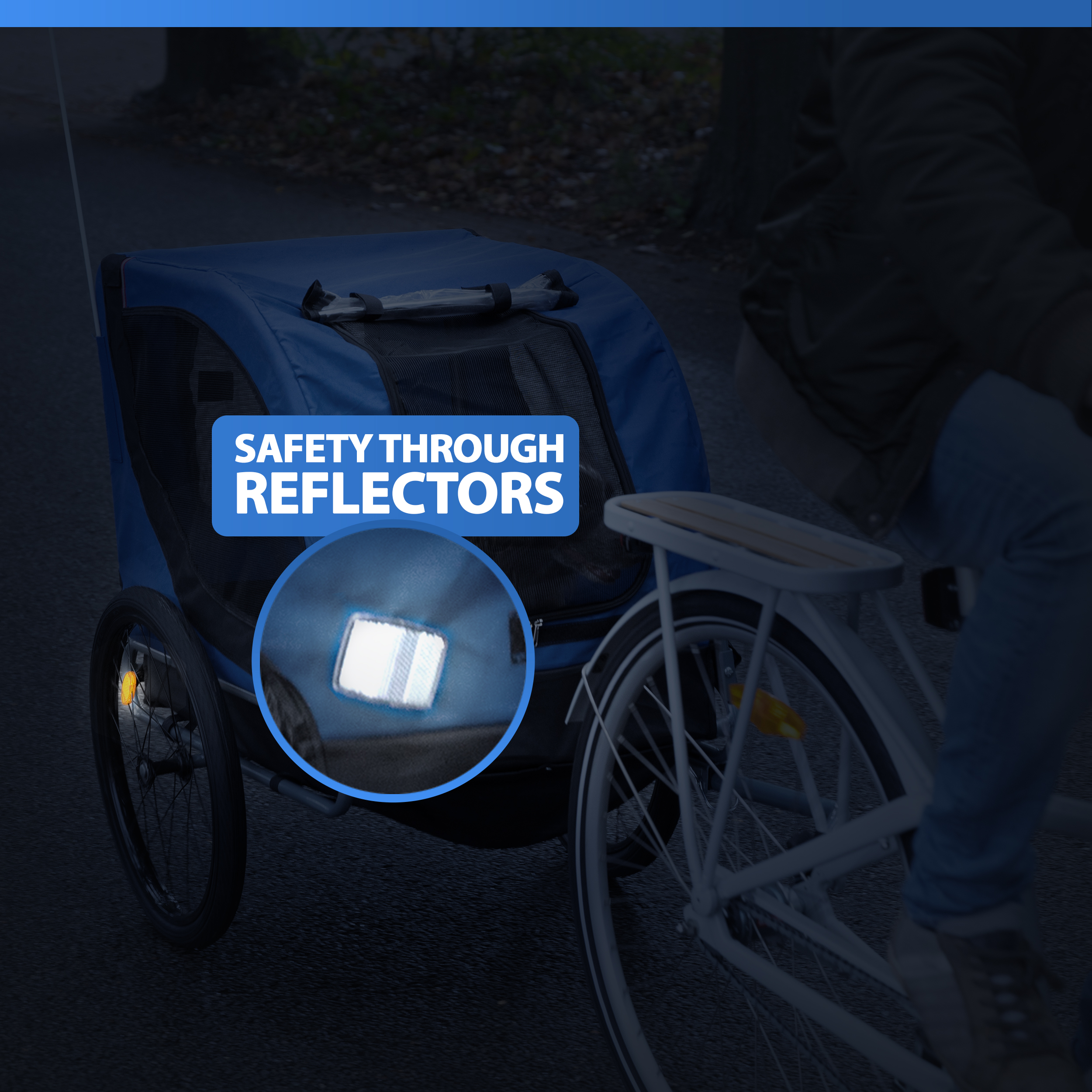 A person rides a bike with a blue trailer that has reflectors.