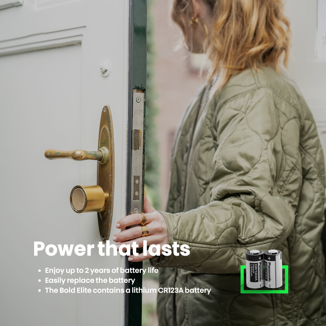 A woman is standing by a door, and batteries are displayed. Text reads "Power that lasts".