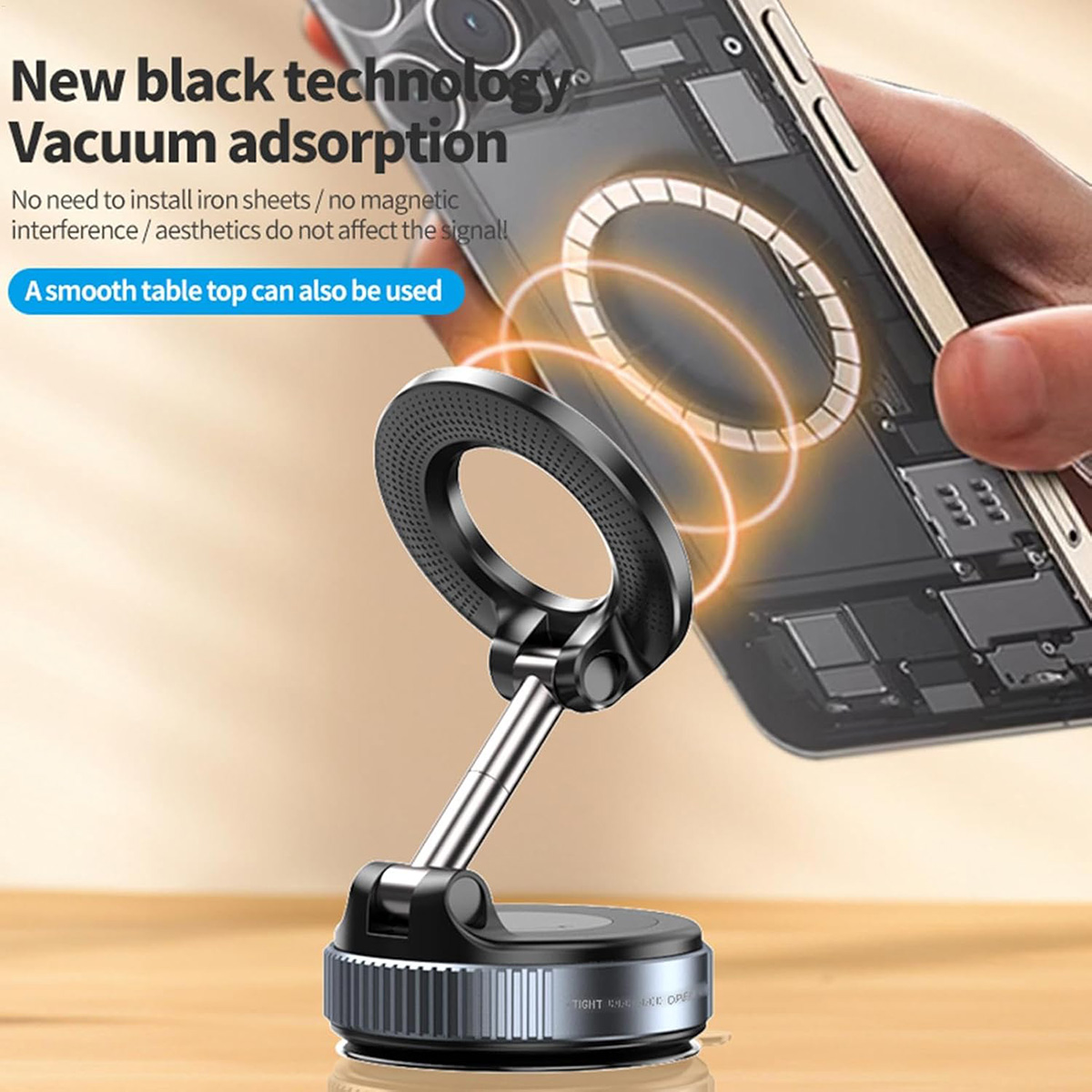 Un soporte para teléfono, con un teléfono al lado. Es un soporte negro con un vástago plateado.